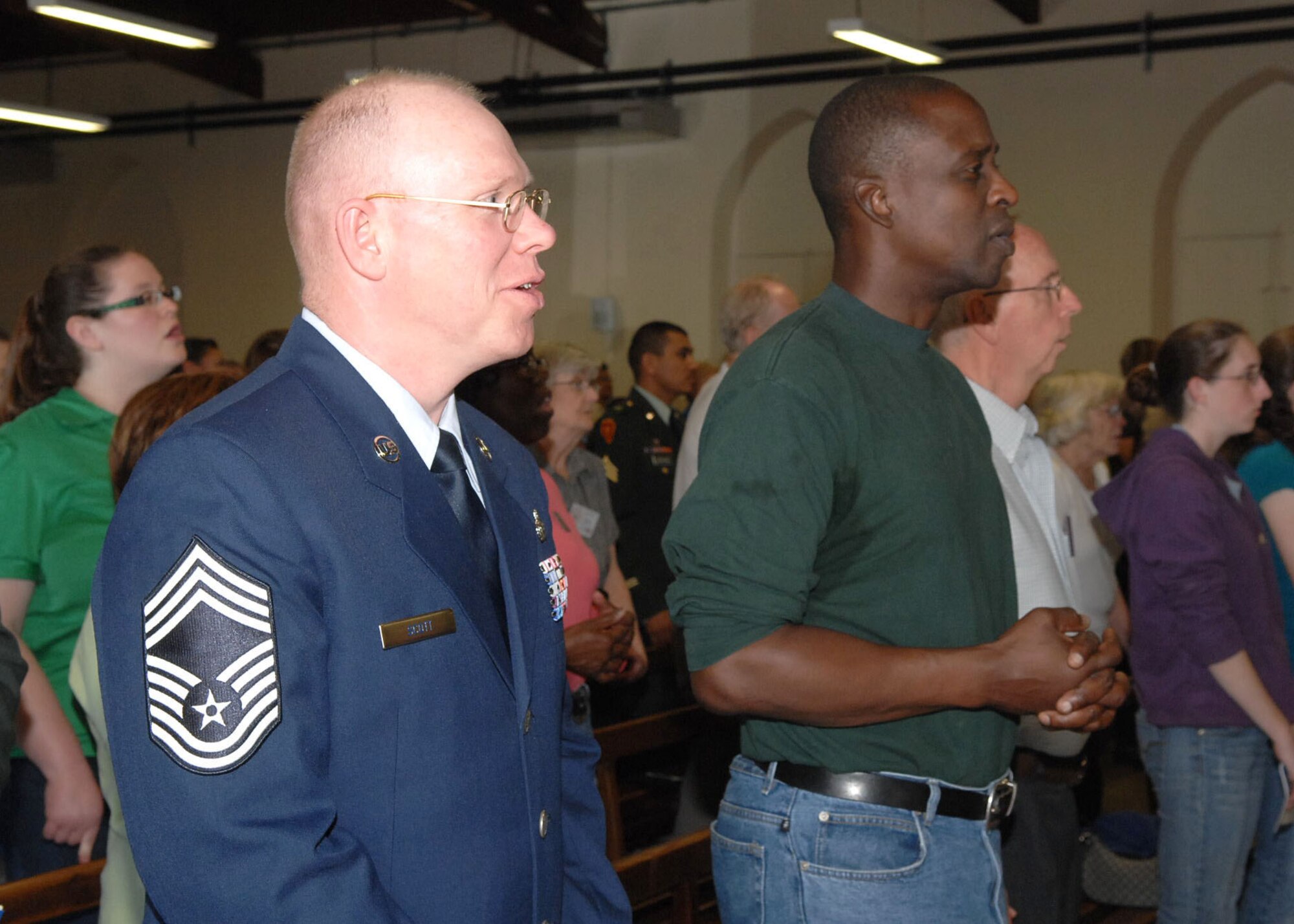 Lourdes, France -- Chief Master Sgt. Steve Scott and Col. Darrell Mosley, both from Ramstein Air Base, celebrate the opening mass for Americans at the 52nd annual International Military Pilgrimage here.  (U.S. Air Force photo by Chief Master Sgt. John Tway)  