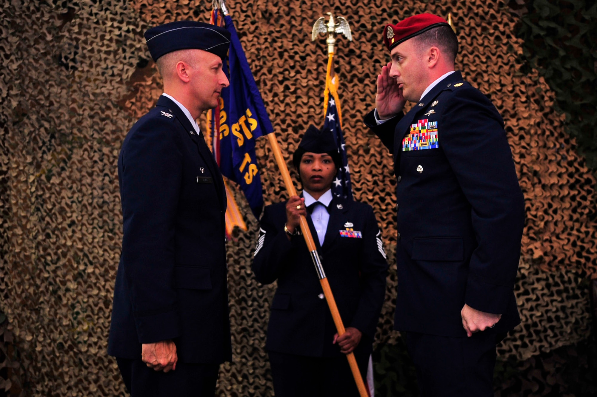 Maj. John Traxler salutes Col. Robert Toth, 353rd Special Operations Group commander, after assuming command of the 320th Special Tactics Squadron change of command May 24, 2010. (U.S. Air Force photo/Senior Airman Amanda Grabiec)