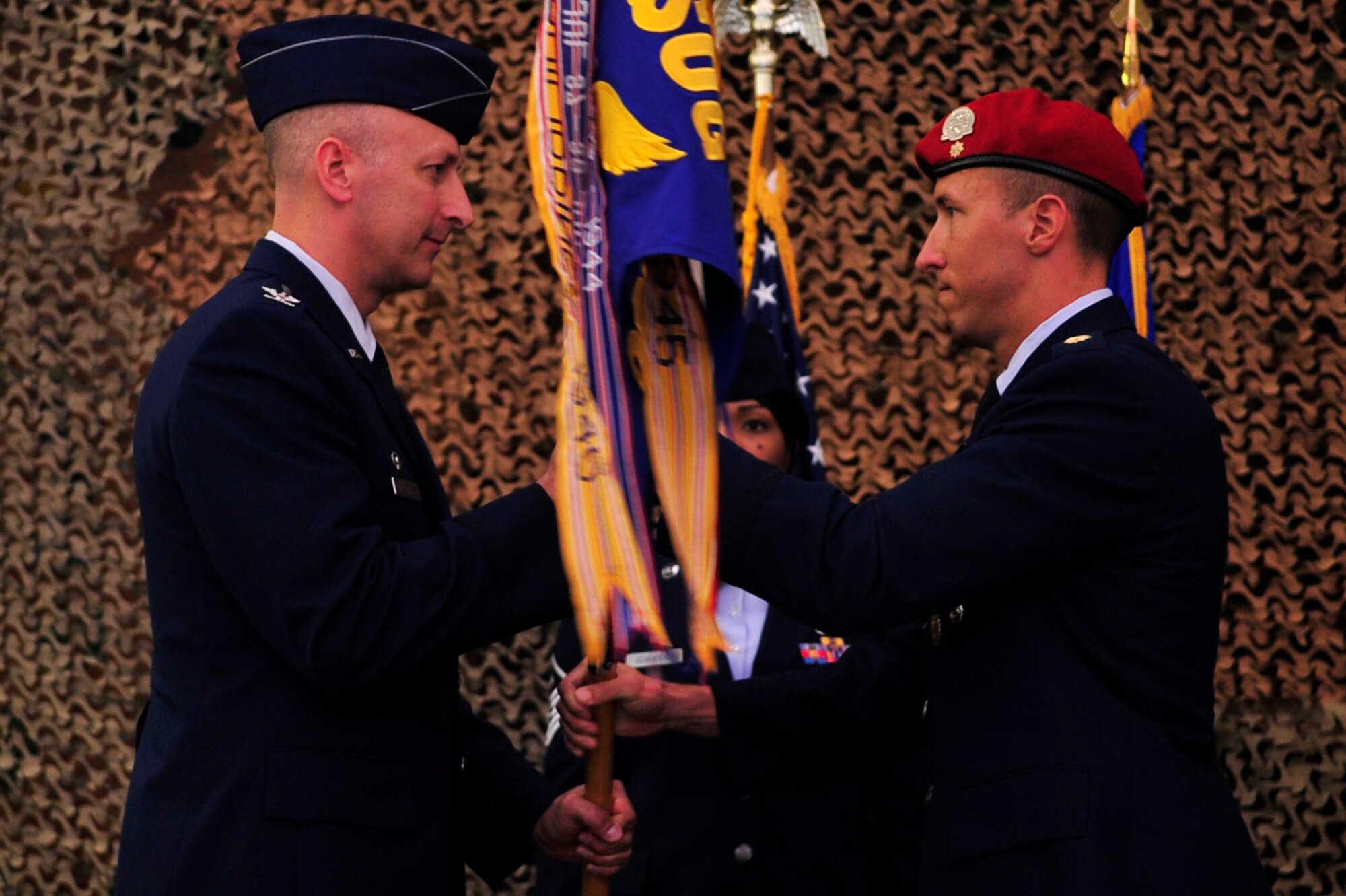 Maj. Jason T. Self relinquishes command after passing the 320th Special Tactics Squadron flag to Col. Robert Toth, 353rd Special Operations Group commander, during the change of command ceremony May 24, 2010. 
(U.S. Air Force photo/Senior Airman Amanda Grabiec)

