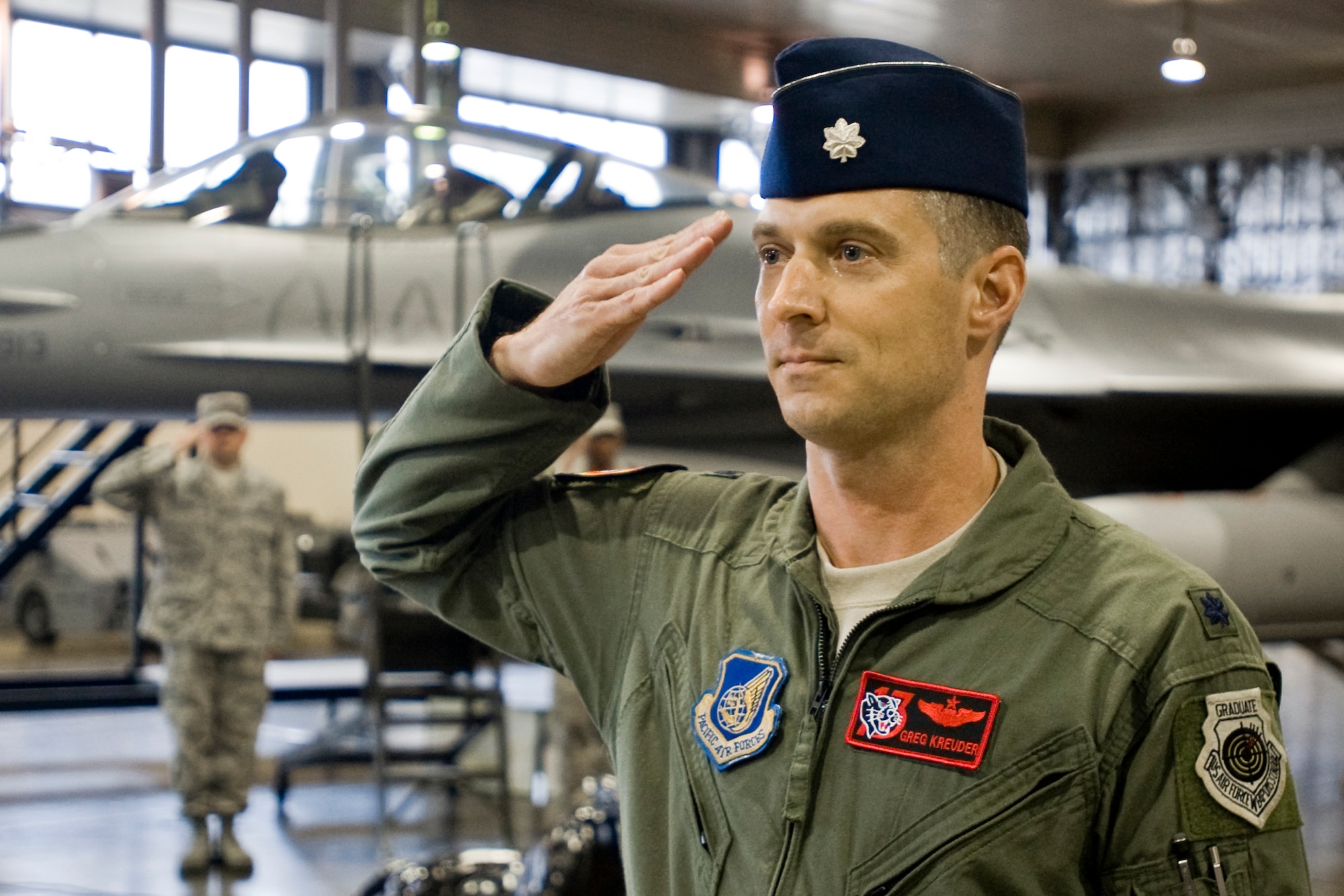 MISAWA AIR BASE, Japan -- Lt. Col. Greg Kreuder renders his first salute as 13th Fighter Squadron commander to members of the 13th FS during a change of command ceremony May 26 at Hangar 911. Colonel Kreuder assumed command of the squadron from Lt. Col. Jay Aanrud. (U.S. Air Force photo/Senior Airman Jamal D. Sutter)