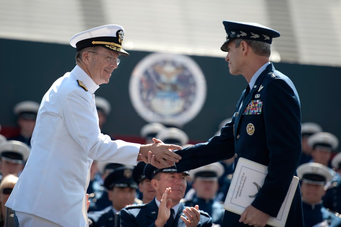 Air Force Chief of Staff Gen. Norton A. Schwartz greets Navy Adm. Mike Mullen, chairman of the Joint Chiefs of Staff, is upon his arrival for commencement exercises in Falcon Stadium at the U.S. Air Force Academy, Colorado Springs, Colo., May 26, 2010.