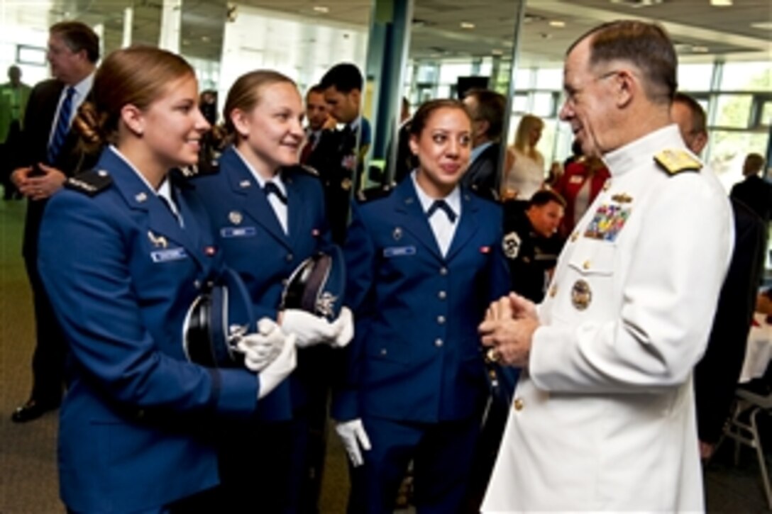 Navy Adm. Mike Mullen, chairman of the Joint Chiefs of Staff, speaks with U.S. Air Force Academy cadet graduates before commencement ceremonies at Falcon Stadium in Colorado Springs, Colo., May 26, 2010.