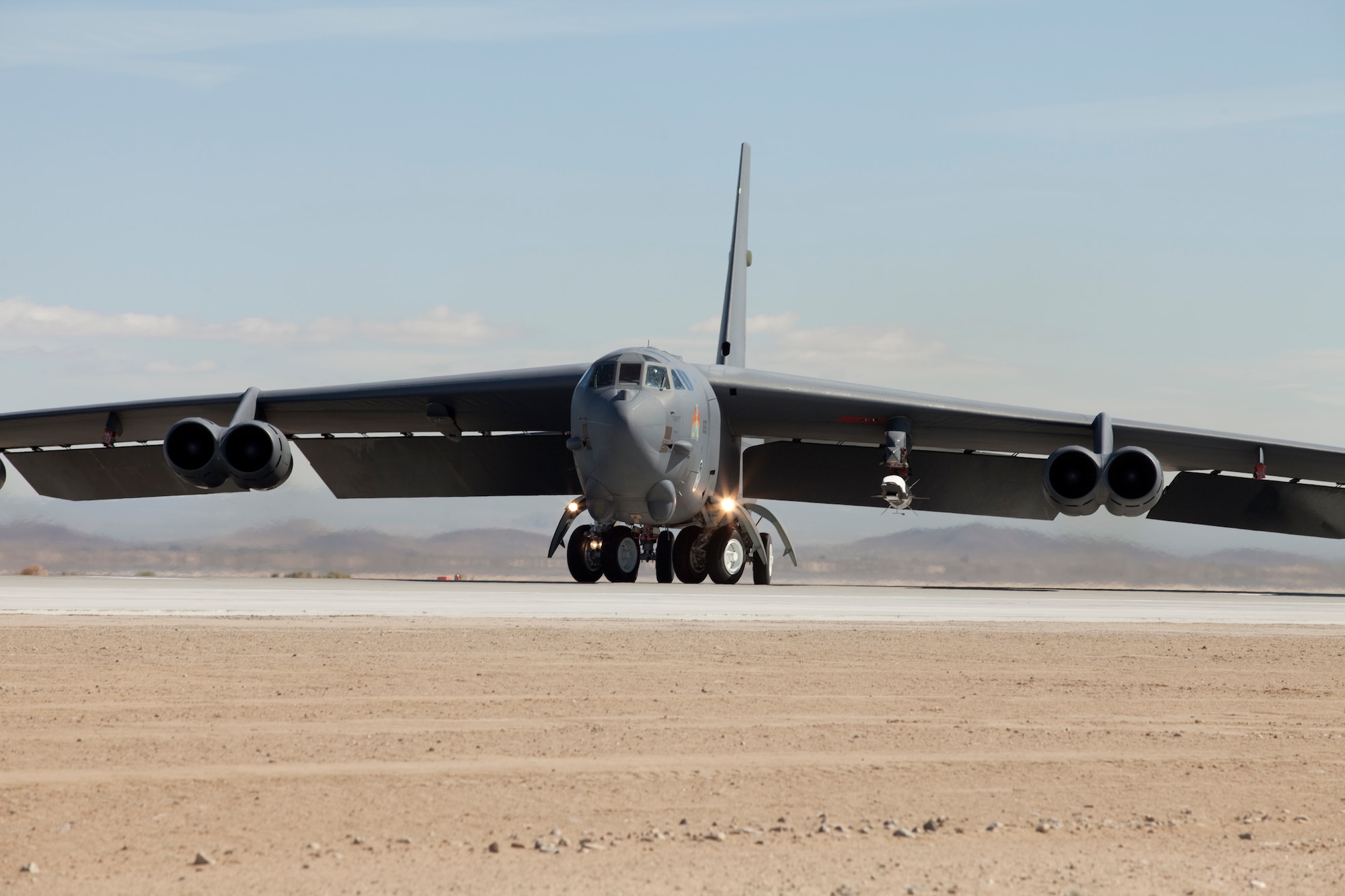 A B-52H carrying an X-51A WaveRider awaits takeoff at Edwards, May 26.  The X-51A is an unmanned scramjet engine demonstrator.  (Air Force photo by Greg Davis)