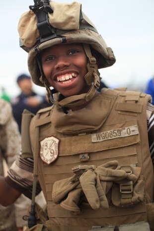 NEW YORK -- Marines from Weapons Company, 3rd Battalion, 9th Marine Regiment, Special Purpose Marine Air Ground Task Force - New York, demonstrated a helicopter raid on the Coney Island Beach, May 27, 2010.  Marines allowed visitors to try on their equipment, hold their weapons and tour the helicopters used for the demonstration. More than 3,000 Marines, Sailors and Coast Guardsmen will be in the area participating in community outreach events and equipment demonstrations. This is the 26th year New York City has hosted the sea services for Fleet Week. (Official Marine Corps photo by Sgt. Randall A. Clinton / RELEASED)