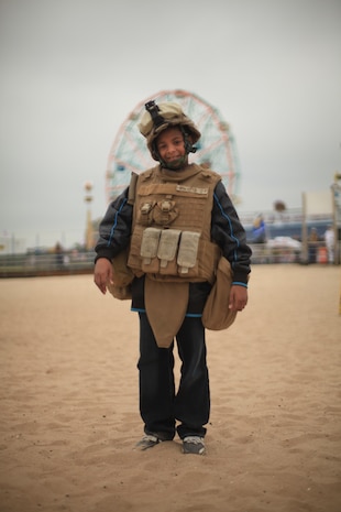 NEW YORK -- Marines from Weapons Company, 3rd Battalion, 9th Marine Regiment, Special Purpose Marine Air Ground Task Force - New York, demonstrated a helicopter raid on the Coney Island Beach, May 27, 2010.  Marines allowed visitors to try on their equipment, hold their weapons and tour the helicopters used for the demonstration. More than 3,000 Marines, Sailors and Coast Guardsmen will be in the area participating in community outreach events and equipment demonstrations. This is the 26th year New York City has hosted the sea services for Fleet Week. (Official Marine Corps photo by Sgt. Randall A. Clinton / RELEASED)