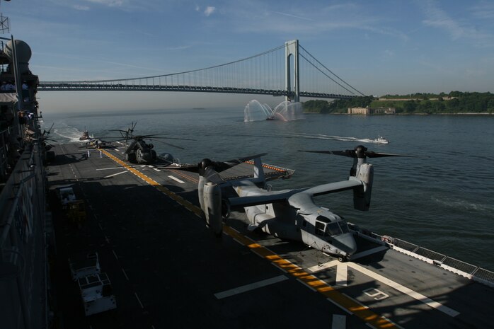 U.S. Sailors and Marines man the rails of the USS Iwo Jima as it pulls into New York for Fleet Week, May 26, 2010. More than 3,000 Marines, Sailors and Coast Guardsmen will be in the area participating in community outreach events and equipment demonstrations. This is the 26th year New York City has hosted the sea services for Fleet Week. (U.S. Marine Corps photo by Cpl. Patrick P. Evenson)