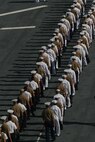 U.S. Sailors and Marines man the rails of the USS Iwo Jima as it pulls into New York for Fleet Week, May 26, 2010. More than 3,000 Marines, Sailors and Coast Guardsmen will be in the area participating in community outreach events and equipment demonstrations. This is the 26th year New York City has hosted the sea services for Fleet Week. (U.S. Marine Corps photo by Cpl. Patrick P. Evenson)