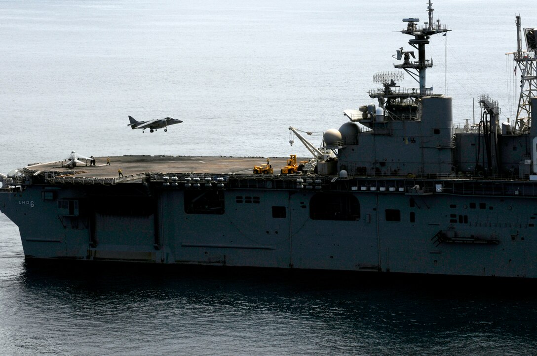 A Marine Attack Squadron 513 AV-8B Harrier lands aboard the USS Bonhomme Richard off the coast of San Clemente Island, Calif., May 26, 2010. The squadron supported the first Exercise Dawn Blitz, an exercise that affords Marines and sailors an opportunity to practice large-scale amphibious assault operations that combine long-range support and close-air support over a two-week period. The Corps intends to hold the exercise annually.