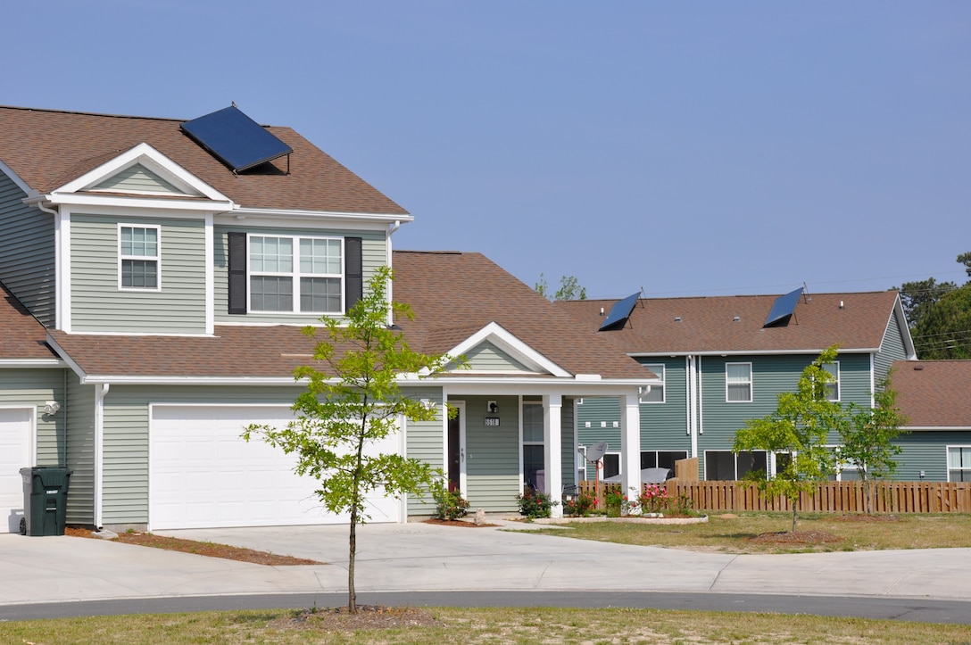 Solar panels recently installed like the ones on these two homes are expected to provide nearly 75 percent of the energy needed to supply domestic hot water for the homes. This will prevent 1,035 tons of carbon dioxide emissions each year, which is equivalent of taking 255 cars off the highway or planting 10 acres of trees.