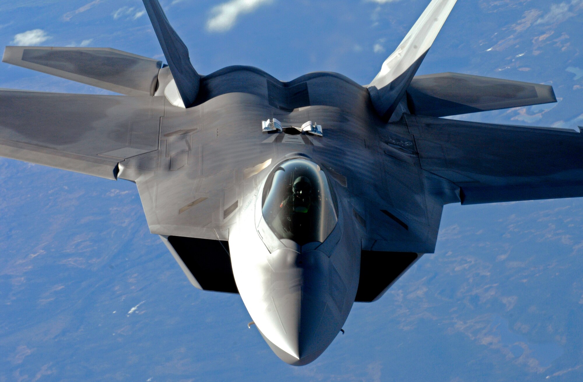 An F-22 Raptor from Elmendorf Air Force Base descends after refueling over Alaska May 26. (U.S. Air force photo/Staff Sgt. Brian Ferguson)