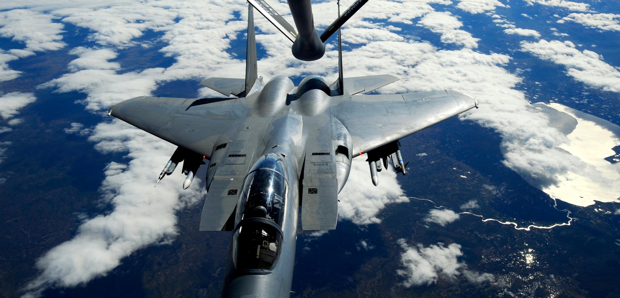 A KC-135 Stratotanker from the 190th Air Refueling Wing, Kansas Air National Guard, refuels an F-15 Eagle from Elmendorf Air Force Base over Alaska May 26. (U.S. Air force photo/Staff Sgt. Brian Ferguson)