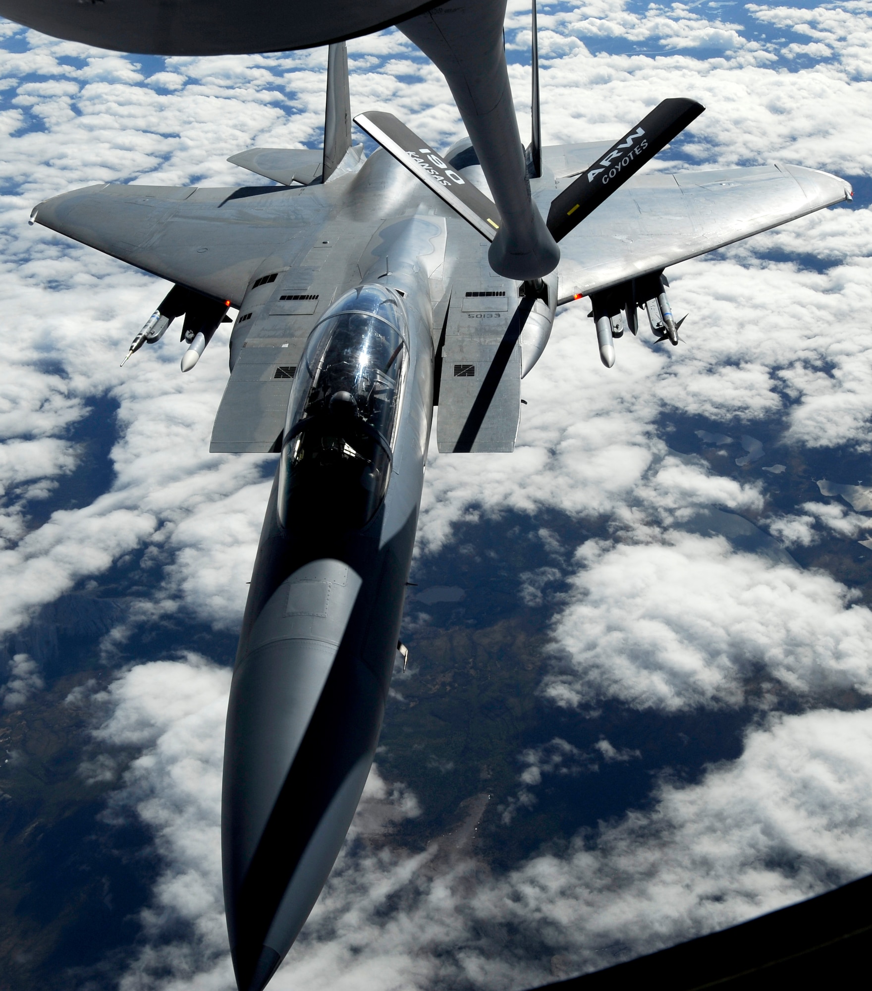A KC-135 Stratotanker from the 190th Air Refueling Wing, Kansas Air National Guard, refuels an F-15 Eagle from Elmendorf Air Force Base over Alaska May 26. (U.S. Air force photo/Staff Sgt. Brian Ferguson)