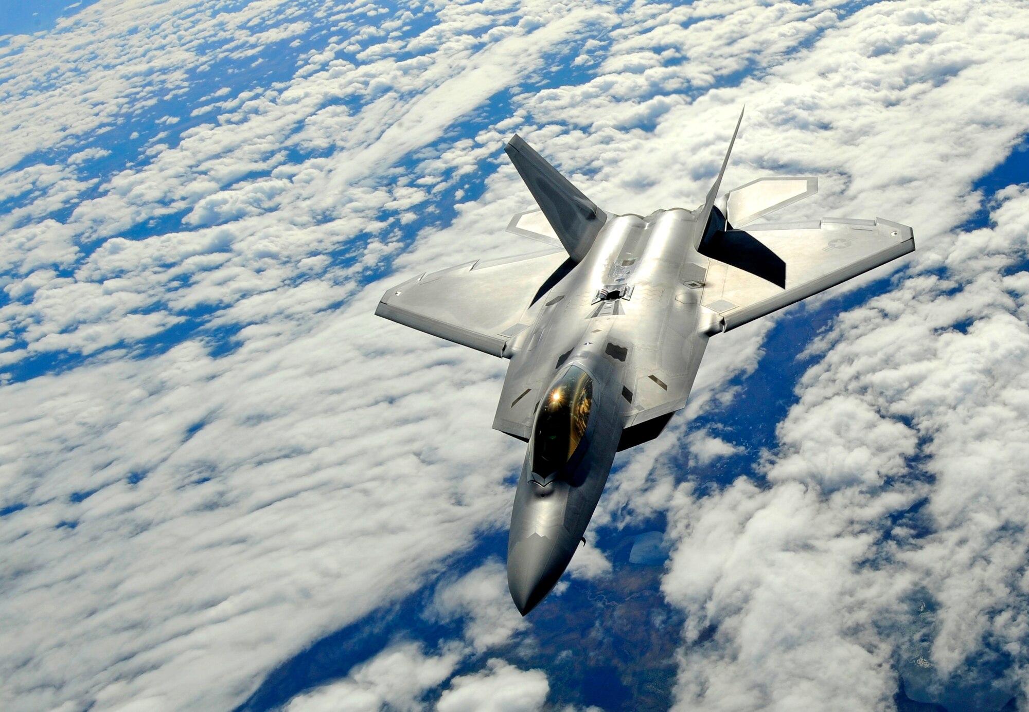 An F-22 Raptor from Elmendorf Air Force Base descends after refueling over Alaska May 26. (U.S. Air force photo/Staff Sgt. Brian Ferguson)