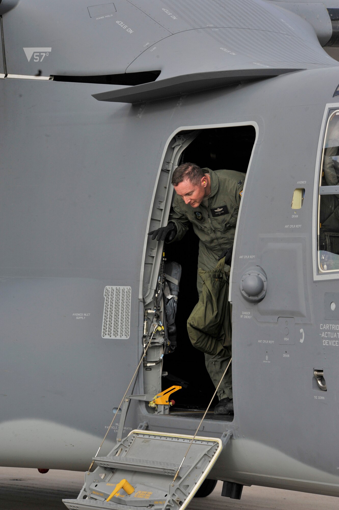 Col. Stephen Clark, 27th Special Operations Wing commander, steps out of the CV-22 Osprey to the Cannon Air Force Base, N.M., flightline, May 26.  Colonel Clark flew the Osprey, the base's second, to the base from Amarillo, Texas, where it was produced by Bell Helicopter.  (U.S. Air Force photo by Staff Sgt. Heather R. Redman)
