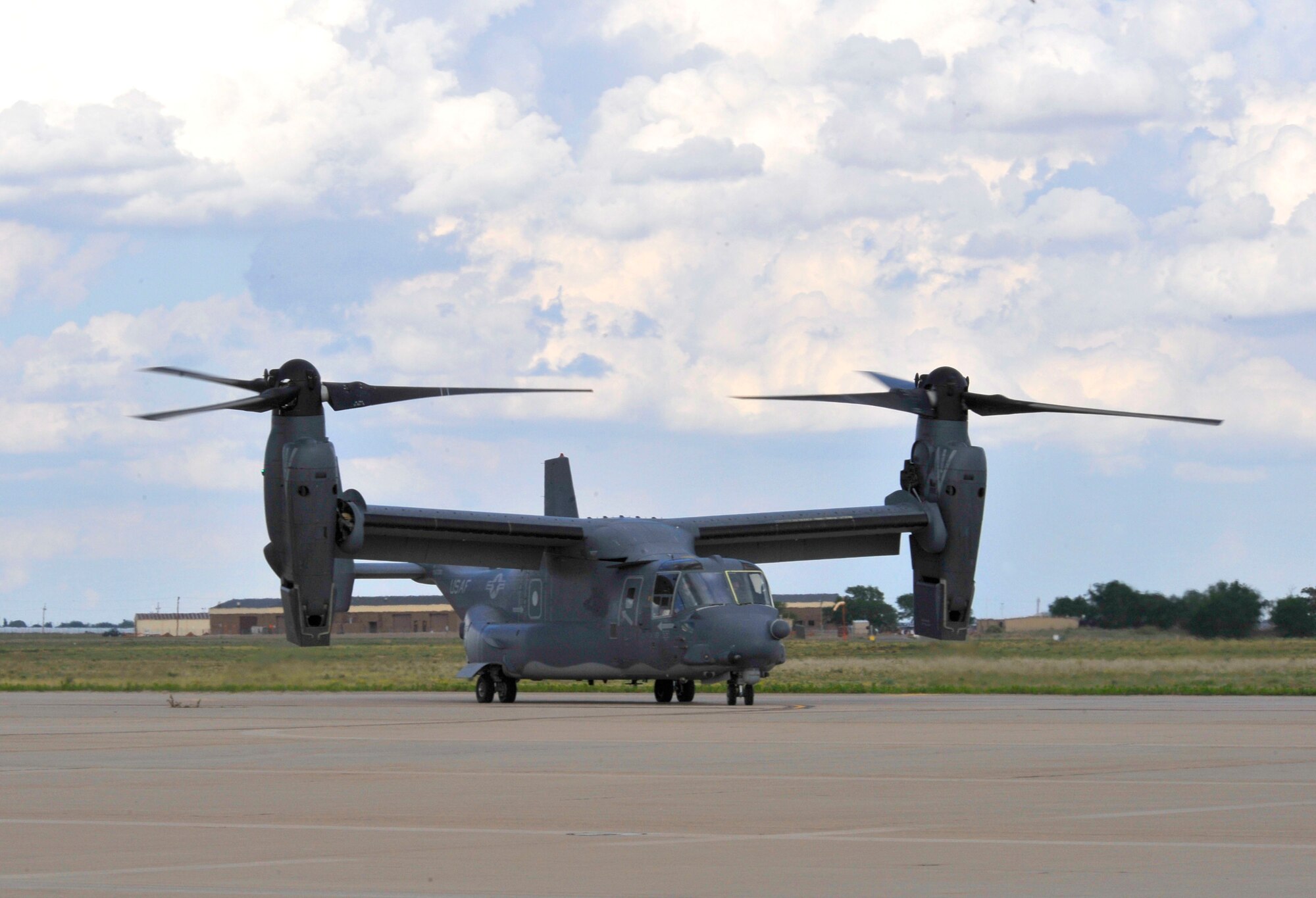 A new CV-22 Osprey lands on the runway at Cannon Air Force Base, N.M., May 26.  The Osprey is assigned to the 20th Special Operations Squadron and is used to conduct day or night low-level penetration into hostile enemy territory, accomplish infiltration and exfiltration, aerial gunnery support and re-supply of special operations forces throughout the world.  (U.S. Air Force photo by Staff Sgt. Heather R. Redman)
