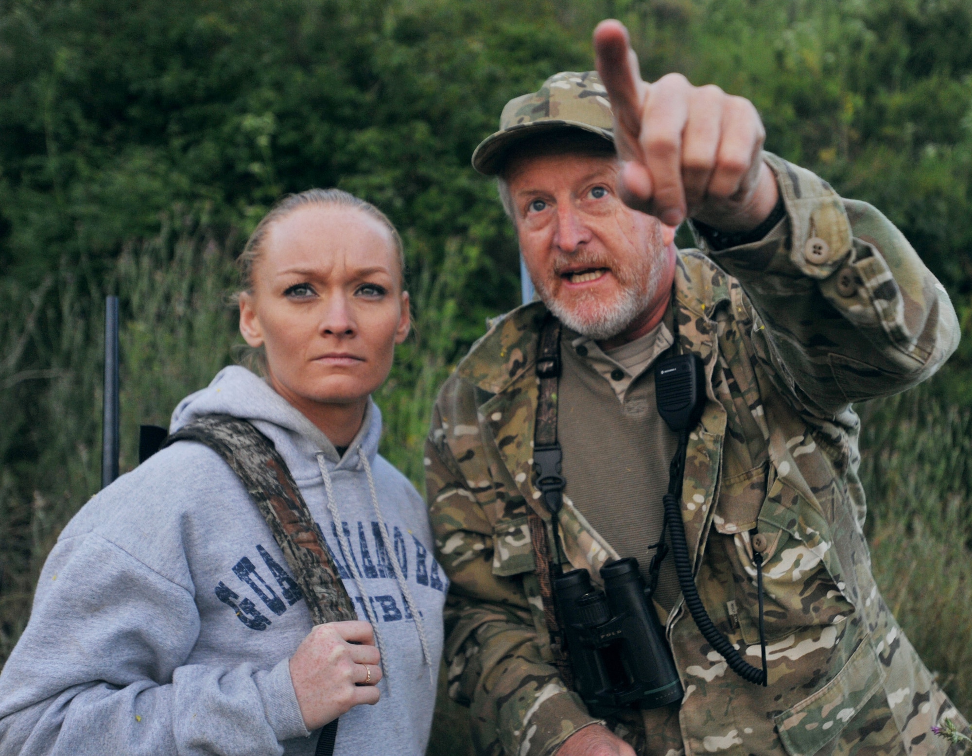 VANDENBERG AIR FORCE BASE, Calif. -- Pointing out where to find the pig, Steve Reisbeck, a local hunter, shows Army Sgt. Kisha Makerney of the 45th Infantry Brigade, 777th Aviation Company, the next place to look during a Wounded Warriors Pig Hunt here Thursday, May 27, 2010. The Wounded Warriors Project provides programs and events to service members who have been injured in combat to boost morale. (U.S. Air Force photo/Senior Airman Christopher Hubenthal) 