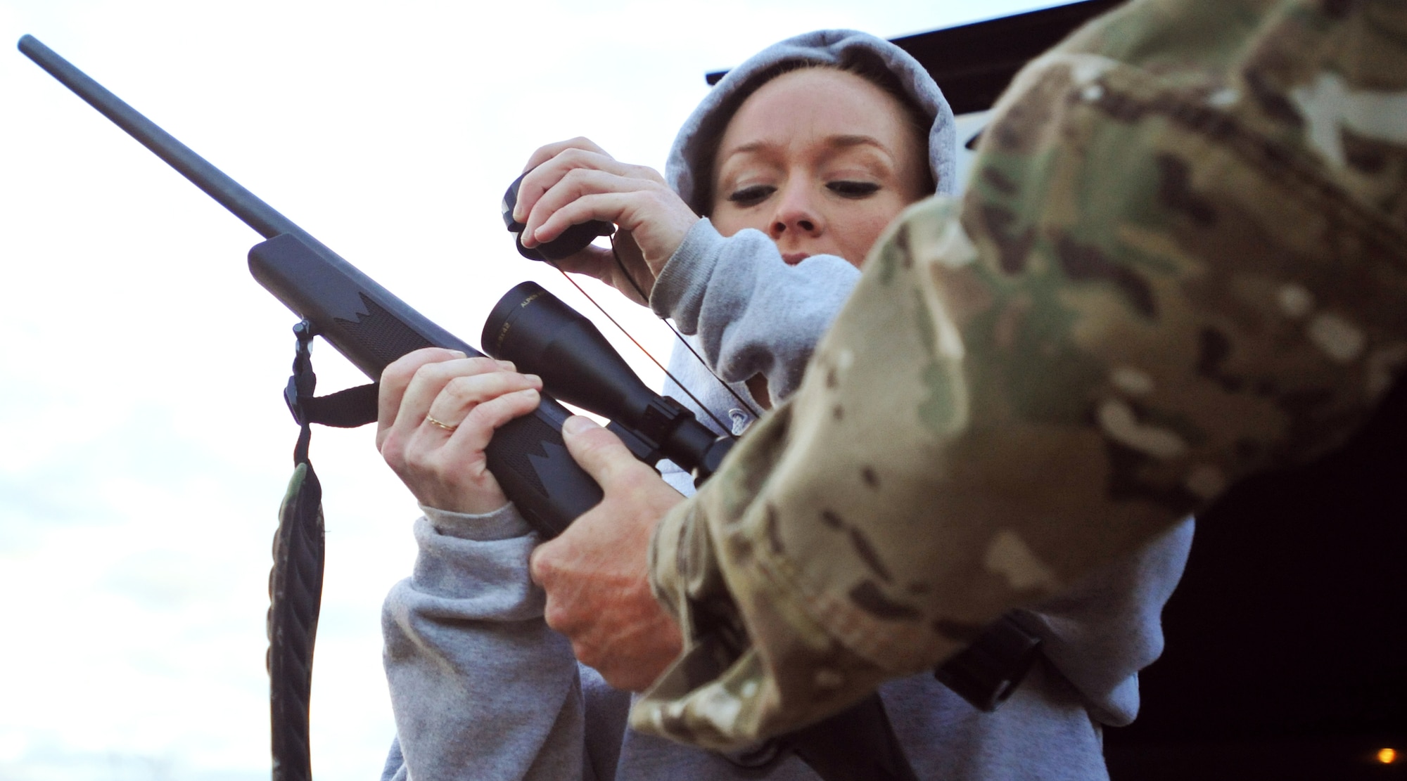 VANDENBERG AIR FORCE BASE, Calif. -- Preparing for the hunt, Army Sgt. Kisha Makerney, of the 45th Infantry Brigade, 777th Aviation Company, does a final check on her rifle during a Wounded Warriors Pig Hunt here Thursday, May 27, 2010. The Wounded Warriors Project provides programs and events to service members who have been injured in combat to boost morale. (U.S. Air Force photo/Senior Airman Christopher Hubenthal) 