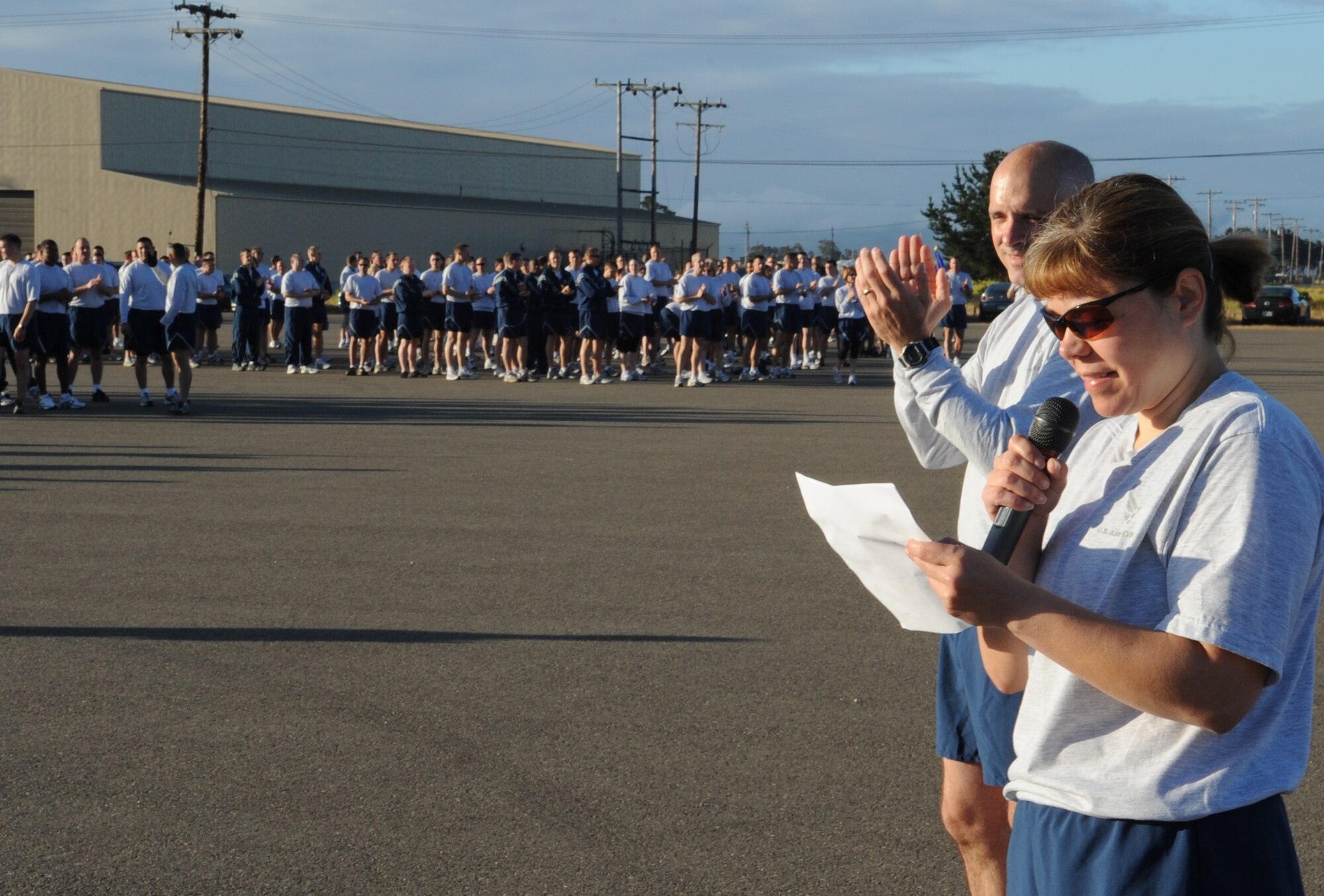 VANDENBERG AIR FORCE BASE, Calif. -- Chief Master Sgt. Angelica Johnson, the 30th Space Wing command chief, and Col. Richard Boltz, the 30th SW commander, announce the master sergeant selectees before the 30th SW 5K Fit-to-Fight run here Thursday, May 27, 2010. Even though they were selected to be master sergeants, the 37 individuals still had to participate in the monthly wing run. (U.S. Air Force photo/Senior Airman Ashley Reed)