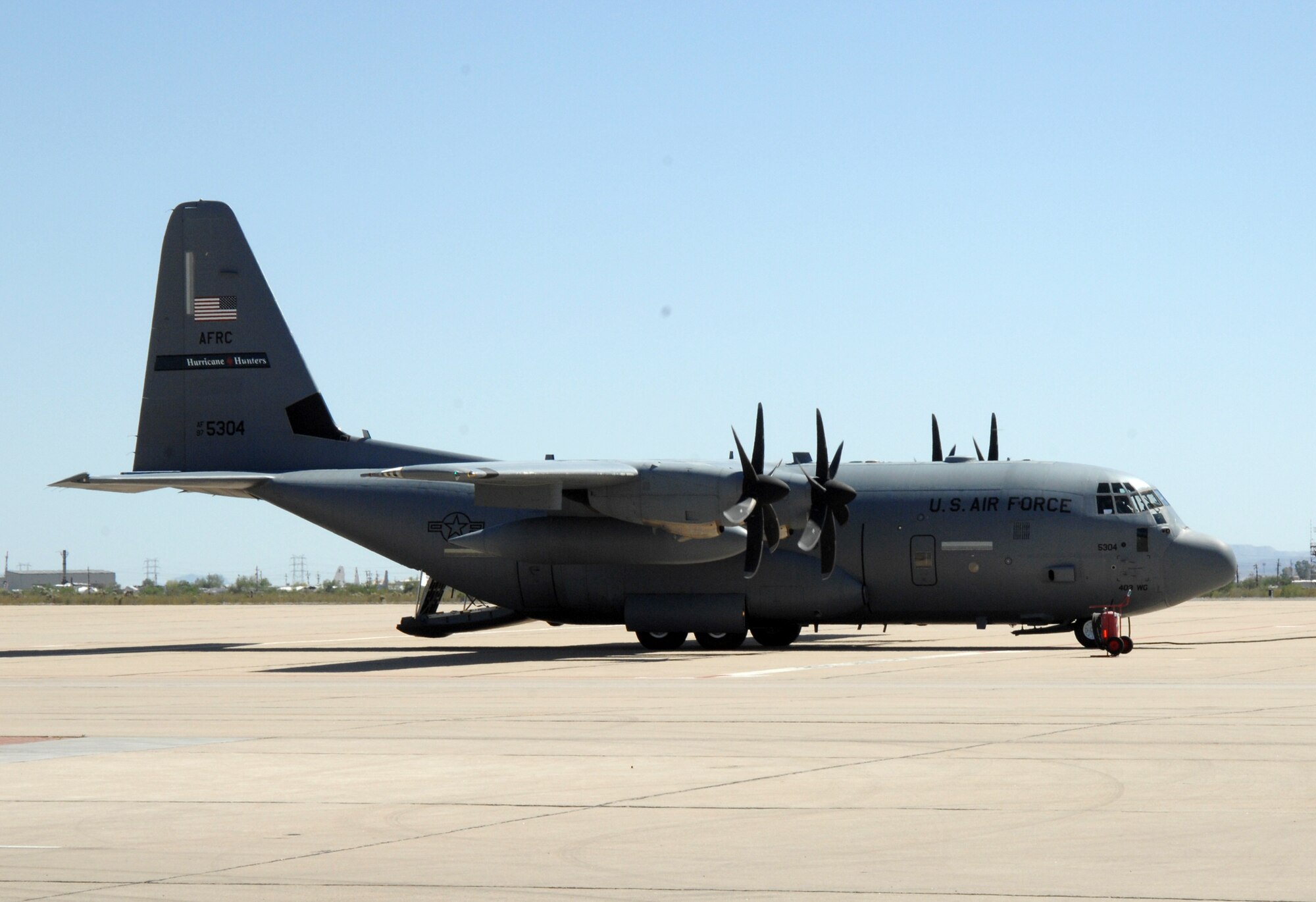 The cargo ramp of a WC-130J opens on the flight line here May 21. The
Hurricane Hunters aircraft and its aircrew stopped at D-M briefly for a
meet-and-greet familiarization with members of the 612th Support Squadron,
who routinely provide weather support for WC-130J missions during hurricane
season. (U.S. Air Force photo/Staff Sgt. Jake Richmond)
