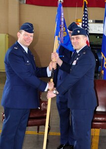 Colonel William Danskine, 612th Theater Operations Group Commander passes command of the 612th Air Base Squadron to Lt. Col. David Cade May 27 at Soto Cano Air Base, Honduras. The mission of the 612th ABS is to provide day/night all weather C-5 capable airfield, base operations support, air traffic control (ATC), weather, crash fire rescue, logistics and base civil engineers to support theater-wide USSOUTHCOM operations. (U.S. Air Force photo/Staff Sgt. Bryan Franks)