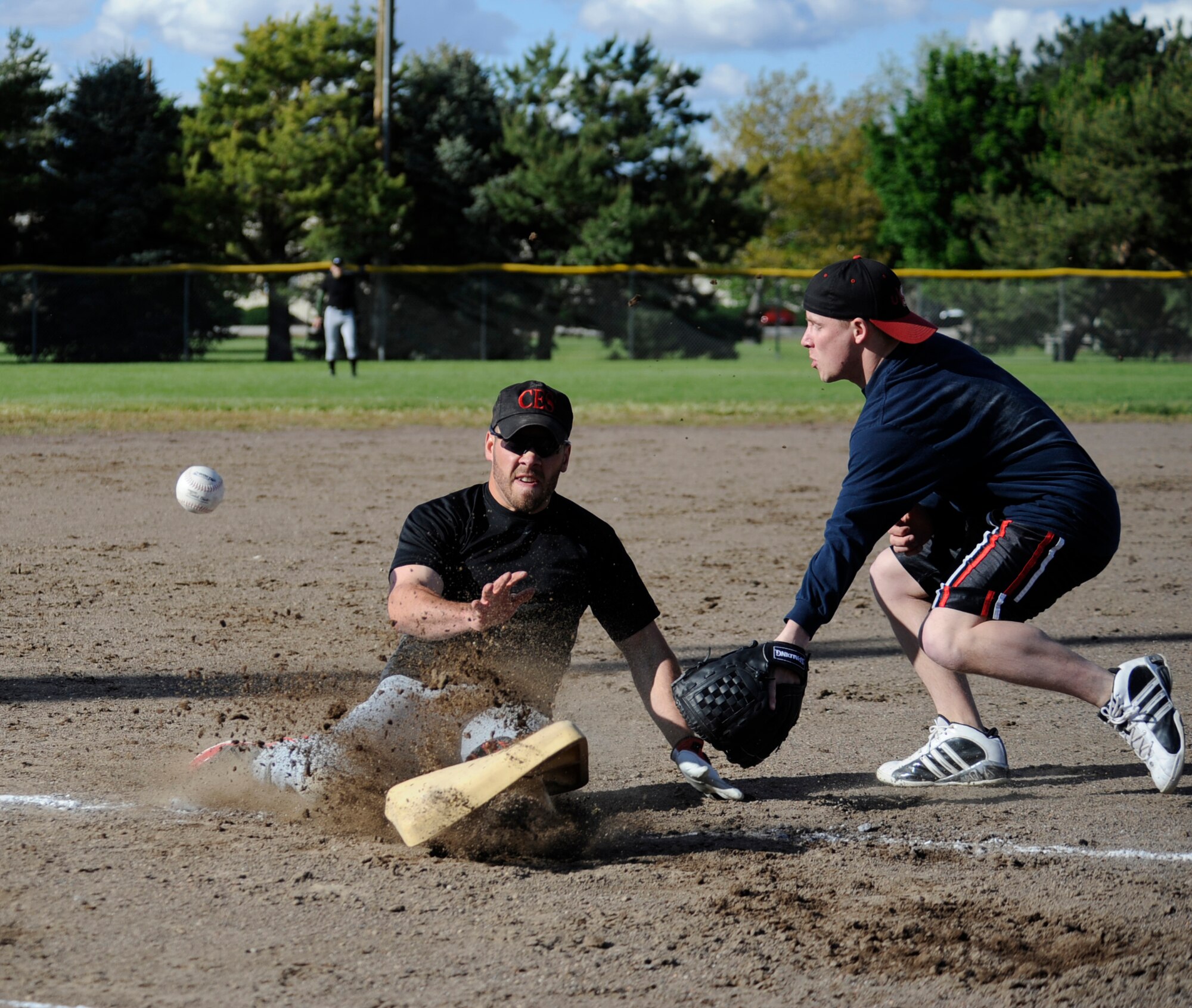 MOUNTAIN HOME AIR FORCE BASE, Idaho -- Kirk Peiffer, Civil Engineer Squadron third baseman, slides into third during an intramural softball game against the 726th May 24. The 726th opened the season with a win over CES 20-19. (U.S. Air Force photo by Airman 1st Class Renishia Richardson)