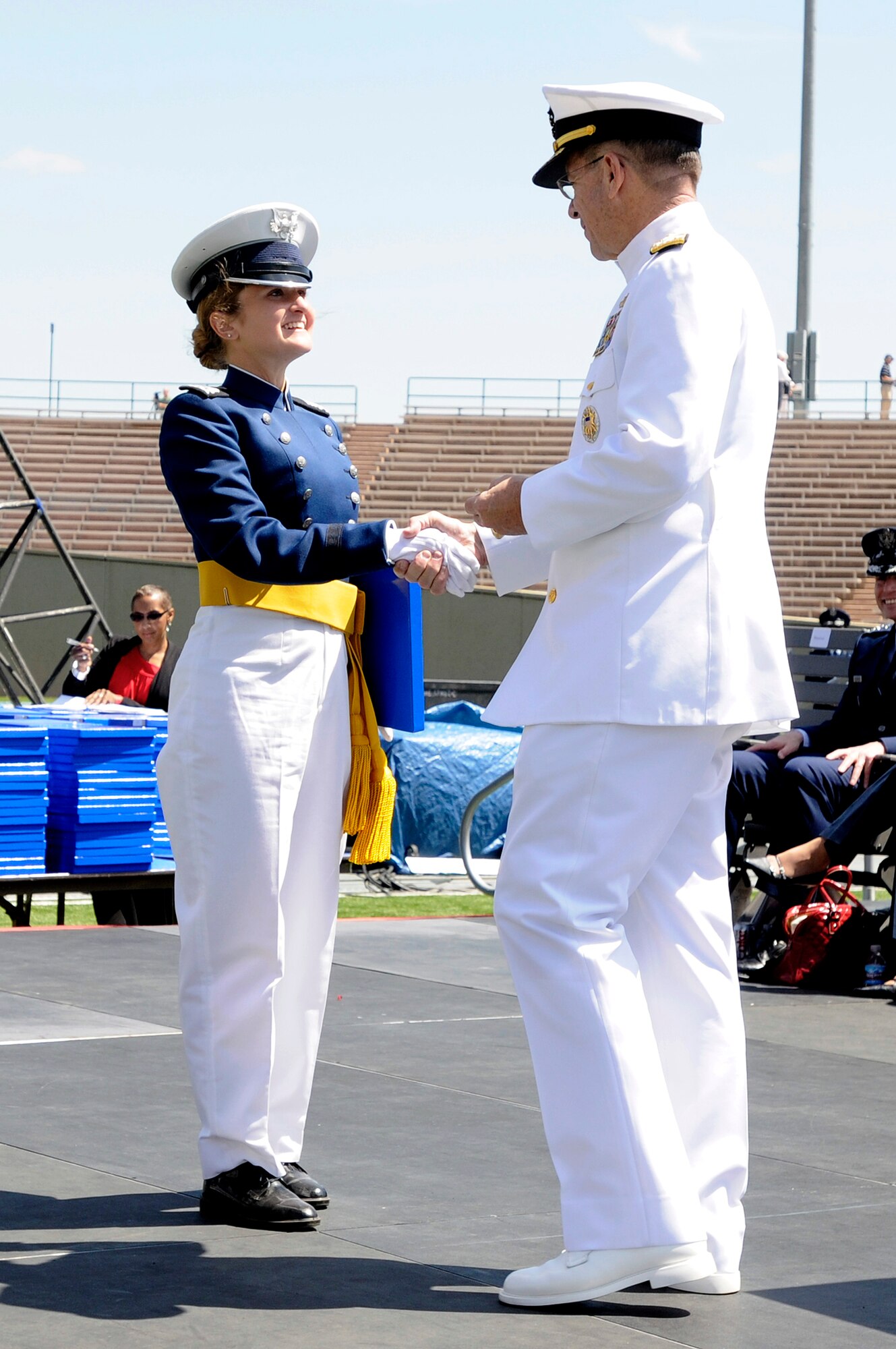 Navy Adm. Mike Mullen congratulates Cadet 1st Class Brittany Morreale on her Rhodes Scholar achievements May 26, 2010, during graduation ceremonies at the U.S. Air Force Academy, Colo. Admiral Mullen was the commencement speaker for the graduation. He is the chairman of the Joint Chiefs of Staff. (U.S. Air Force photo/Bill Evans) 