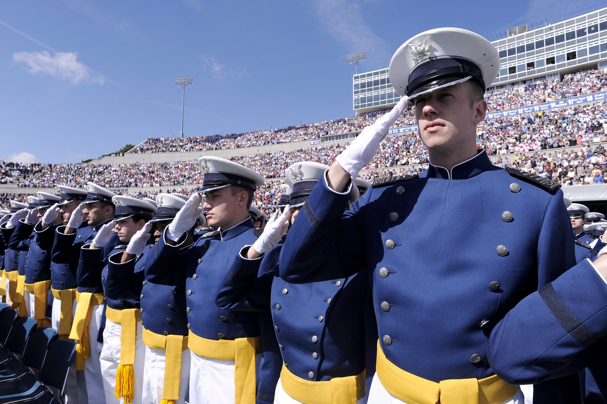 Class of 2010 graduates salute for the national anthem at the commencement of the graduation ceremony May 26, 2010, at the U.S. Air Force Academy, Colo. Navy Adm. Mike Mullen delivered the commencement address. Admiral Mullen is the  chairman of the Joint Chiefs of Staff. (U.S. Air Force photo/Mike Kaplan)