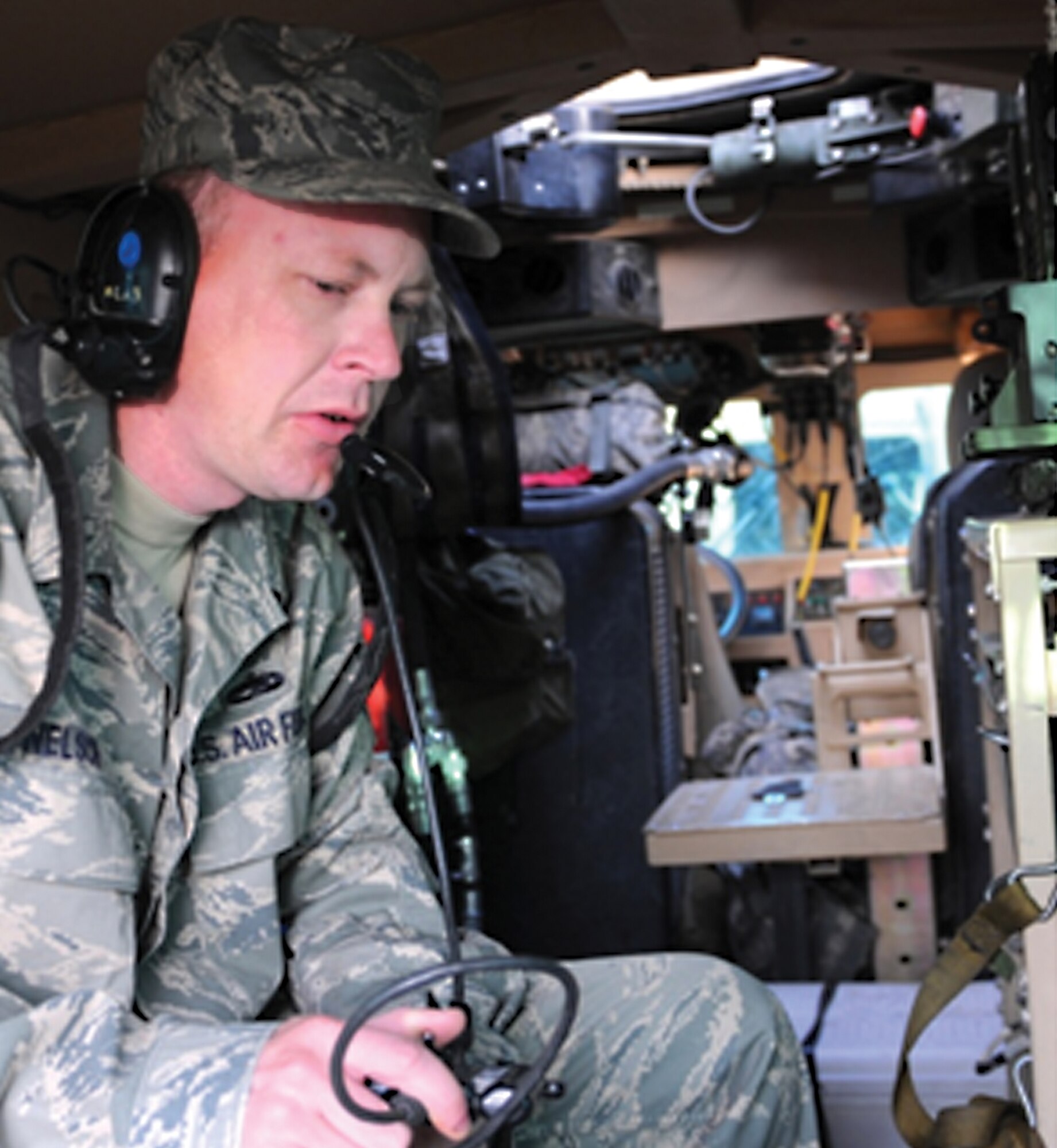 Staff Sgt. Douglass Nelson, a 3rd Combat Communications Group member deployed with a Provincial Reconstruction Team in Afghanistan, dedicates countless hours making sure all PRT Mine-Resistant Ambush-Protected vehicles have proper communication. (Air Force photo by Staff Sgt. Jeffrey Byrd)
