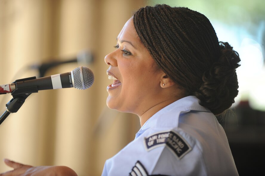 HONOLULU - Air Force Tech Sgt. Tamiko Boone, a vocalist for the Band of the Pacific-Hana Hou performs during Military Appreciation Day activities at Kapiolani Park in Honolulu, Hawaii on May 22. Active duty, guard and reserve military members participated in a Welcome Home Parade, which was followed up with entertainment at the Waikiki Shell with performances by four local Hawaii bands and a military joint jazz ensemble. The event was organized by the USO, the Chamber of Commerce Military Affairs Council and BAE Systems. (U.S.  Air Force photo/Tech Sgt. Cohen A. Young)