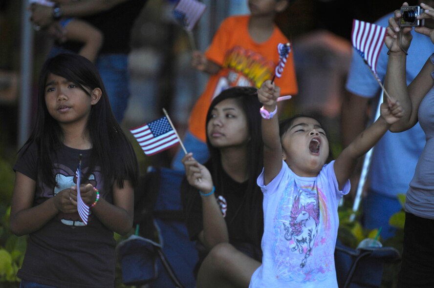 HONOLULU - A little girl shouts with excitement as active duty, guard and reserve personnel from the Army, Navy, Air Force, Marines and Coast Guard walk by in formation as part of a Welcome Home Parade, which was one of many Military Appreciation Day events held in Honolulu on May 22. The parade was followed up with entertainment at the Waikiki Shell with performances by four local Hawaii bands and a military joint jazz ensemble. The event was organized by the USO, the Chamber of Commerce Military Affairs Council and BAE Systems. (U.S.  Air Force photo/Tech Sgt. Cohen A. Young)