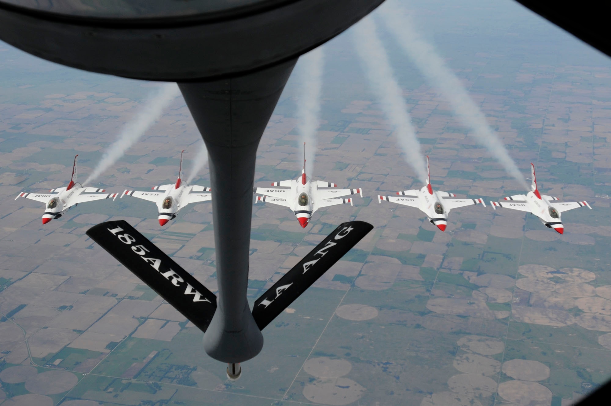 High above the farmland of eastern Nebraska a formation of Thunderbirds puts on a small show prior to being refueled.  The United States Air Force's premier demonstration team is behind a KC-135 from the Sioux City, Iowa Air National Guard's 185th Air Refueling Wing. The Thunderbirds recently performed at the United States Air Force Academy Graduation on May 26th and are on their way to the Southern Wisconsin Air Fest in Janesville Wisconsin for a Memorial Day weekend performance on May 29 and 30.
USAF Photo MSGT Vincent De Groot 185ARW PA
