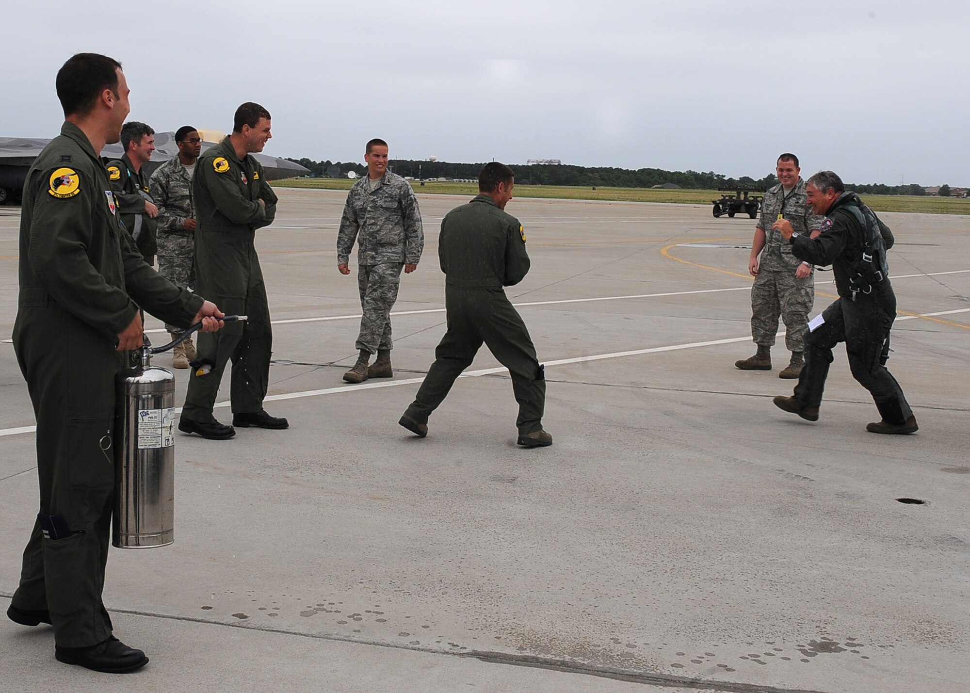 LANGLEY AIR FORCE BASE, Va. -- Lt. Col. Robert Sandford, 192d Fighter Wing chief of standardization and evaluation, gets hosed down after surpassing 4,000 flight hours May 17. Sandford said the milestone was not particularly on of his goals, but merely a result of his adoration for flying. (U.S. Air Force photo/Airman 1st Class Gul Crockett)