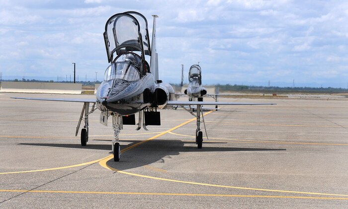 Two T-38 “Talon” aircraft taxi in from the runway after a training flight May 26 at the flight line. The T-38 is used to train U-2 “Dragon Lady” pilots and keep them current on their instrumentation. (U.S. Air Force photo by Airman 1st Class David Tracy)