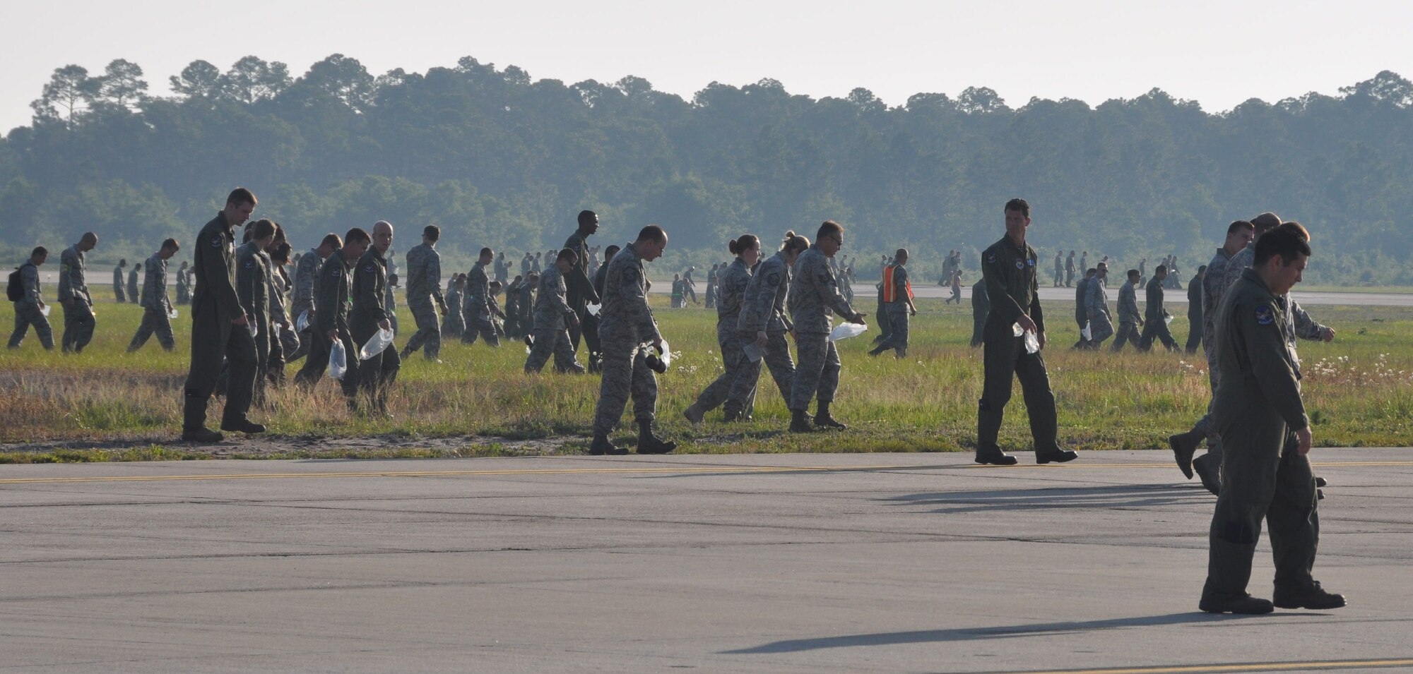 Team Tyndall members gathered to perform a Wing Foreign Object Debris Walk on the flight line May 24.  More than 180 pounds of FOD were picked up during the walk.  (U.S. Air Force photo by Airman 1st Class Rachelle Elsea)