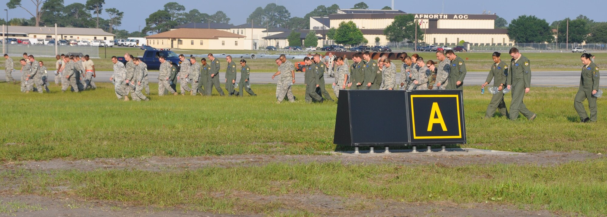 Team Tyndall members gathered to perform a Wing Foreign Object Damage Walk on the flight line May 24.  More than 180 pounds of FOD were picked up during the walk.  (U.S. Air Force photo by Airman 1st Class Rachelle Elsea)