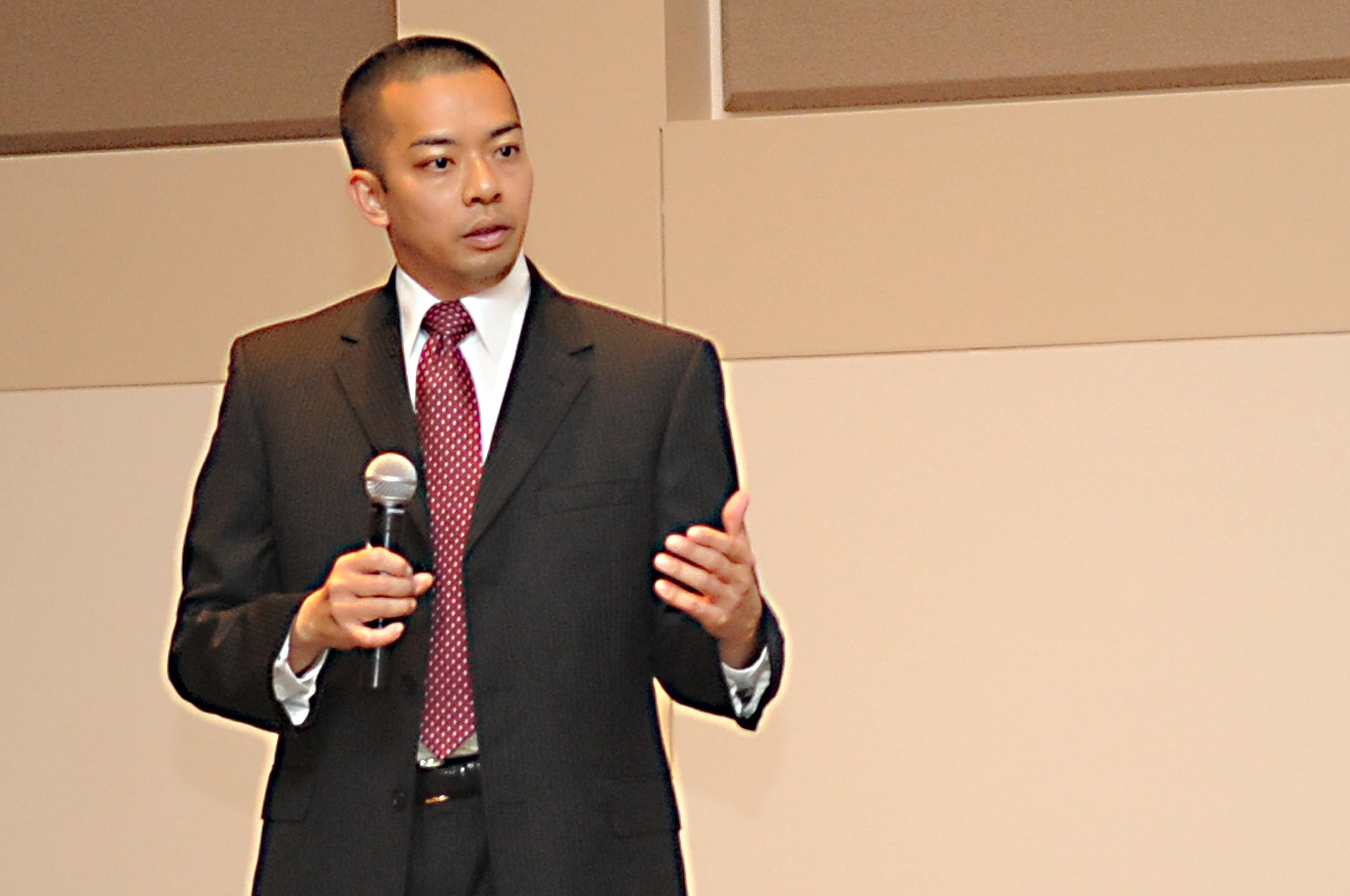 BUCKLEY AIR FORCE BASE, Colo. -- Dennis Kaw speaks to Team Buckley at the Asian Pacific Heritage food tasting May 26 about pride as United States military servicemembers and Asian-Americans' pride in their heritage. (U.S. Air Force Photo by Airman 1st Class Manisha Vasquez)