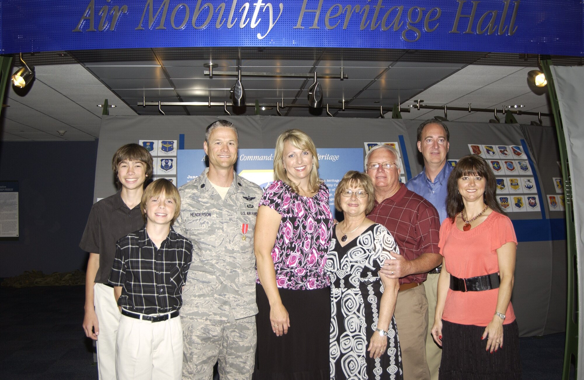 Lt. Col. Charles Henderson, Air Mobility Command Test and Evaluation
Squadron commander, poses with his family after receiving a Bronze Star for
his deployment in Baghdad, Iraq as Air Liaison Officer to the Iraqi Ministry
of Defense, Joint Operations Center from Sept. 20, 2009 to Mar. 31, 2010.

