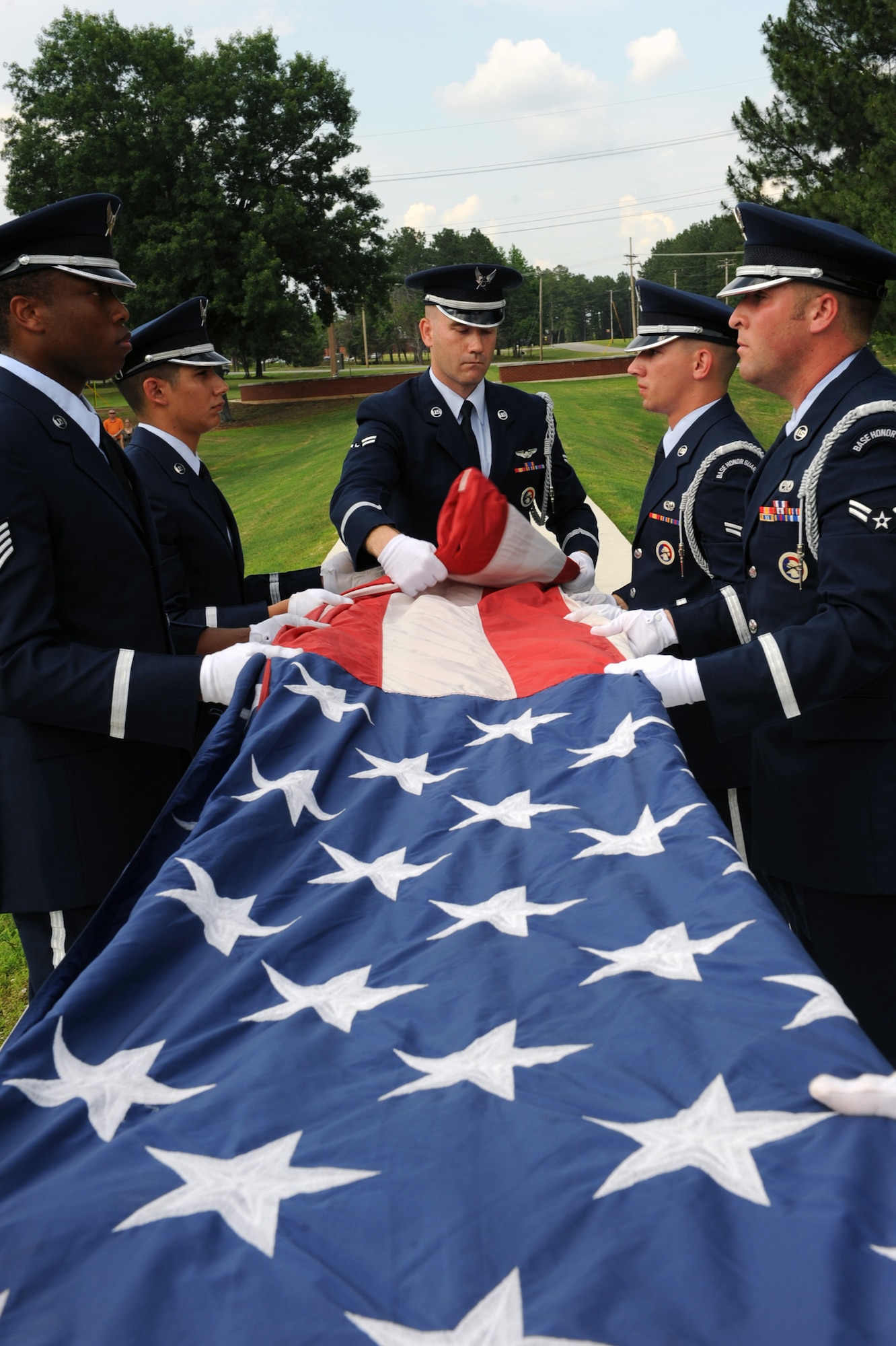 Little Rock Air Force Base Honor Guard Airmen fold the flag during the base’s Memorial Day retreat ceremony May 26. (U.S. Air Force photo by Senior Airman Ethan Morgan)
