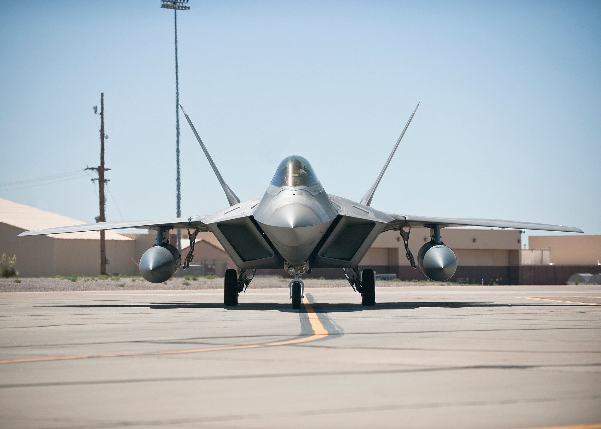 HOLLOMAN AIR FORCE BASE, N.M. -- An F-22 Raptor taxis out to the end of the runway before takeoff May 24, 2010. Twelve F-22's from Holloman are deploying to Kadena Air Base, Japan, for approximately four months as part of a U.S. Pacific Command Theater Security Package. (U.S. Air Force photo by Senior Airman DeAndre Curtiss / Released)