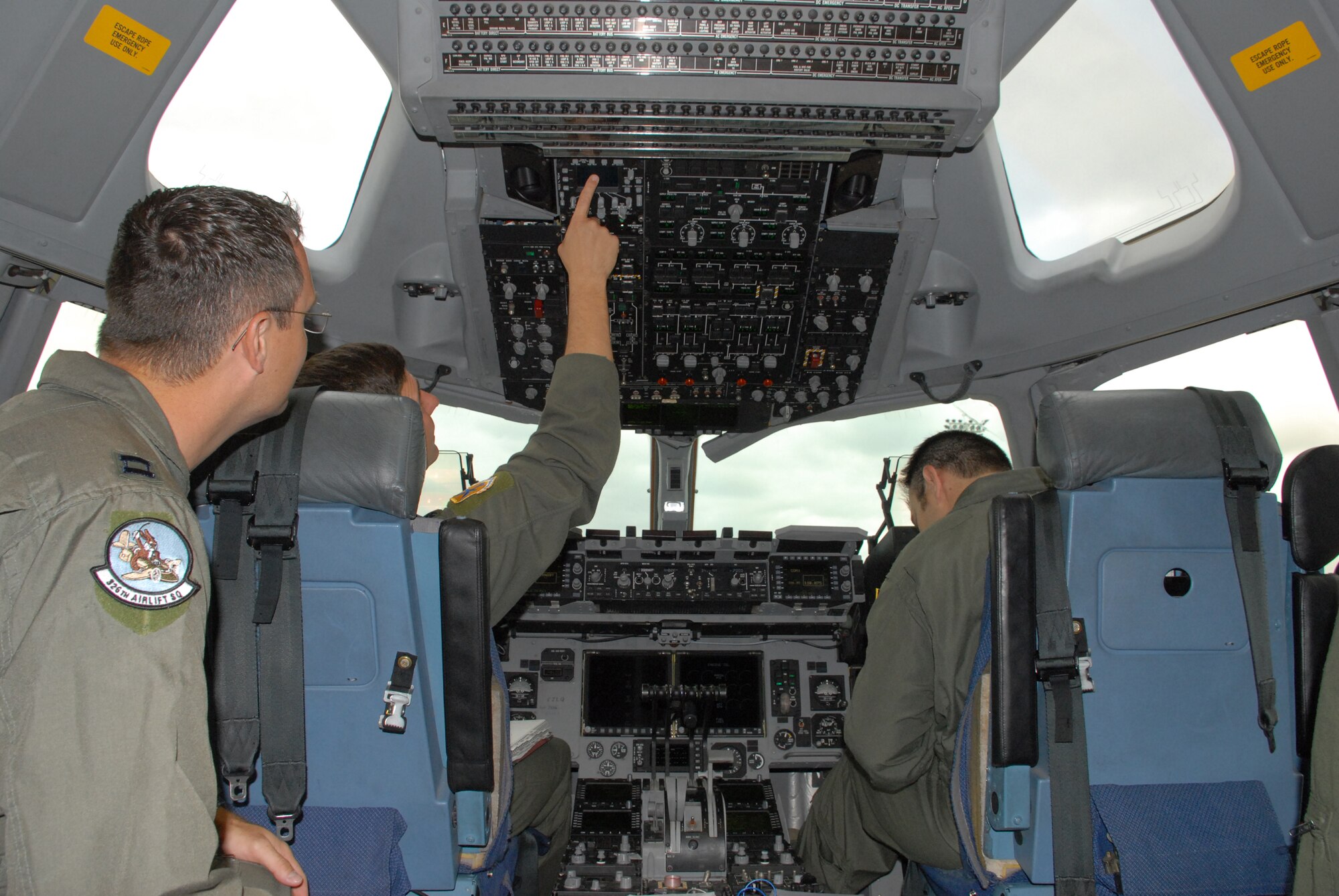 (Left) Capt Jason Pennypacker, 326th Airlift Squadron aircraft commander, Lt Col Richard Sheetz, 436th Operations Group deputy commander, and Capt Patrick McClintock, 3rd Airlift Squadron instructor pilot, complete the pre-flight inspections before kicking-off Dover's participation in Mobility Air Forces Exercise May 19.  MAFEX is an exercise that is performed twice a year and is planned by weapons school students, in which they integrate C-17s and C-130s with fighters under one single exercise. (U.S Air Force photo/2d Lt. Jennifer Guerrero) 