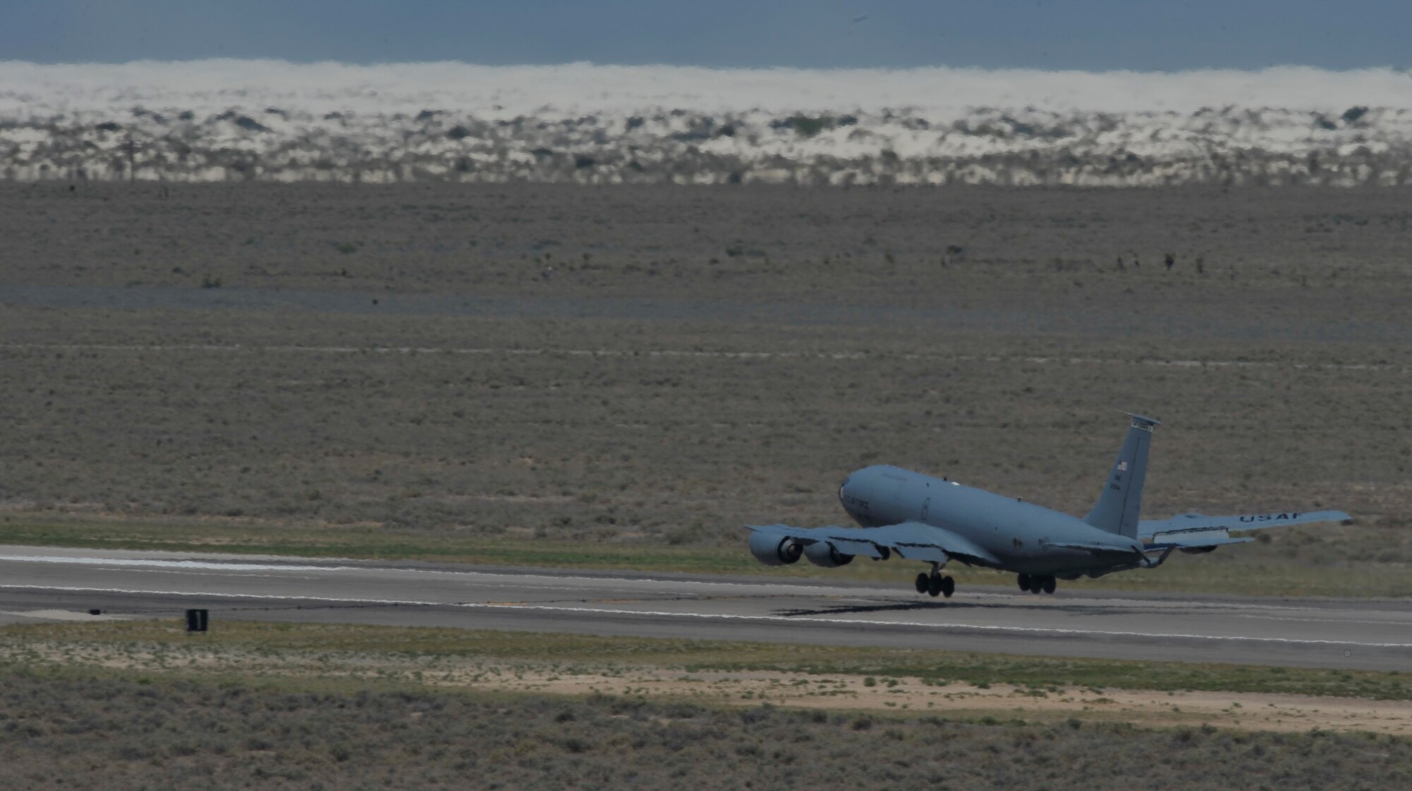 HOLLOMAN AIR FORCE BASE, N.M. -- A KC-135 Stratotanker assigned to McConnell Air Force Base, Kan., takes off May 24, 2010, as part of a deployment to Kadena Air Base, Japan. The KC- 135 followed F-22 Raptors from Holloman to assist in air refueling. As part of continuing force posture adjustments to address worldwide requirements, the United States continues to deploy additional forces throughout the Western Pacific as part of U.S. Pacific Command's Theater Security Package. This is the latest example of the flexibility U.S. forces have to meet their ongoing commitments and security obligations throughout the Pacific region. (U.S. Air Force photo by Airman 1st Class Joshua Turner / Released)