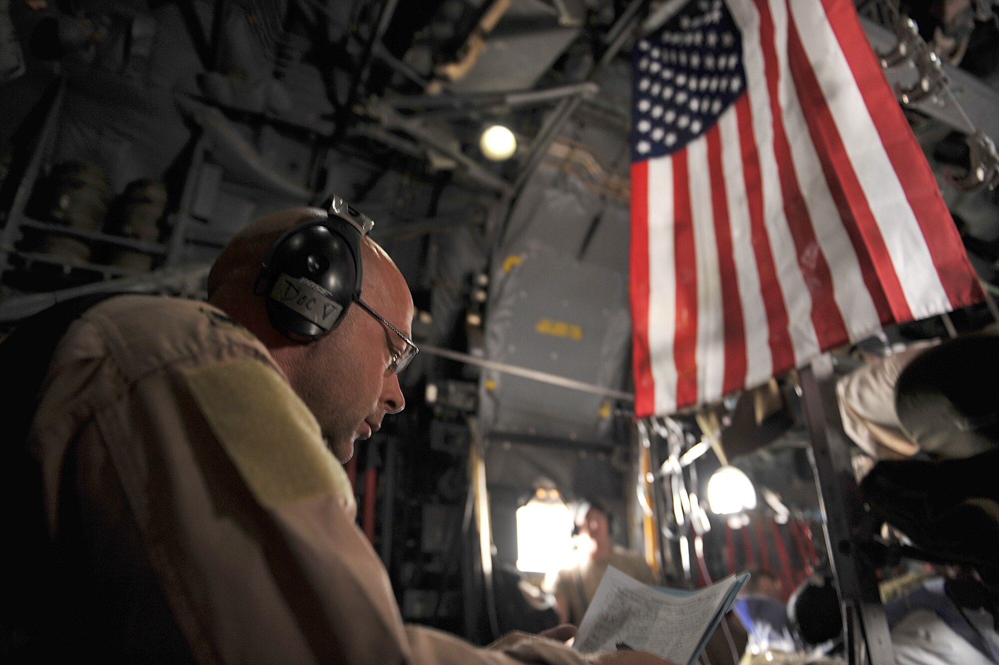 U.S. Air Force flight doctor, Lt. Col. Scott Vandenhoef, checks a patient's medical records during an aeromedical evacuation mission, May 13, 2010.  Doctor Vandenhoef is deployed to the 451st Expeditionary Aeromedical Evacuation Squadron, Camp Bastion, Afghanistan.  (U.S. Air Force photo/Staff Sgt. Quinton Russ/released)