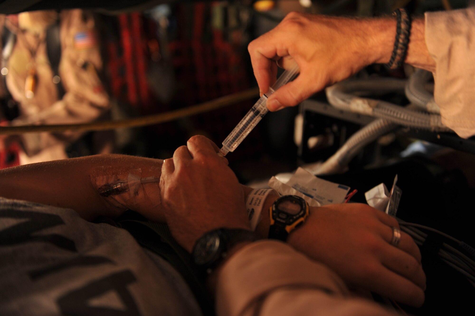 U.S. Air Force flight doctor, Lt. Col. Scott Vandenhoef, administers some medication during an aeromedical evacuation mission, May 13, 2010.  Doctor Vandenhoef is deployed to the 451st Expeditionary Aeromedical Evacuation Squadron, Camp Bastion, Afghanistan.  (U.S. Air Force photo/Staff Sgt. Quinton Russ/released)
