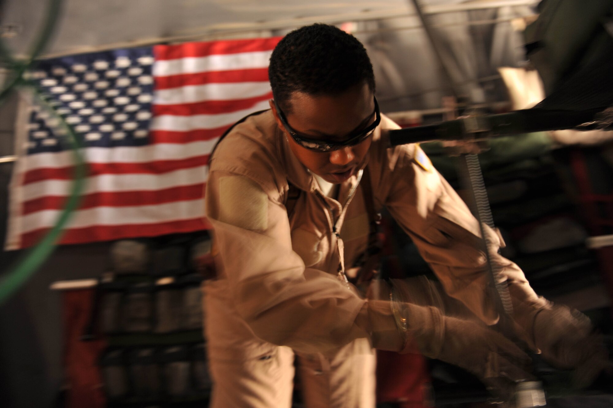 U.S. Air Force medical technician, Tech. Sgt. Melinda Ford, secures a litter to a C-130 Hercules during an aeromedical evacuation mission at Joint Base Balad, Iraq, May 13, 2010.  Sergeant Ford is deployed to the 332nd Expeditionary Aeromedical Evacuation Flight, Joint Base Balad, Iraq.  (U.S. Air Force photo/Staff Sgt. Quinton Russ/released)