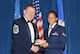McGHEE TYSON AIR NATIONAL GUARD BASE, Tenn. -- Senior Airman Caressa M. Gibson, 175th Wing, Maryland Air National Guard, right, receives the distinguished graduate award for Airman Leadership School Class 10-3 at The I.G. Brown Air National Guard Training and Education Center here from Chief Master Sgt. Michael R. Francis, Command Chief Master Sergeant, New Jersey Air National Guard, May 20, 2010.  The distinguished graduate award is presented to students in the top ten percent of the class.  It is based on objective and performance evaluations, demonstrated leadership, and performance as a team player. (U.S. Air Force photo by Master Sgt. Kurt Skoglund /Released)