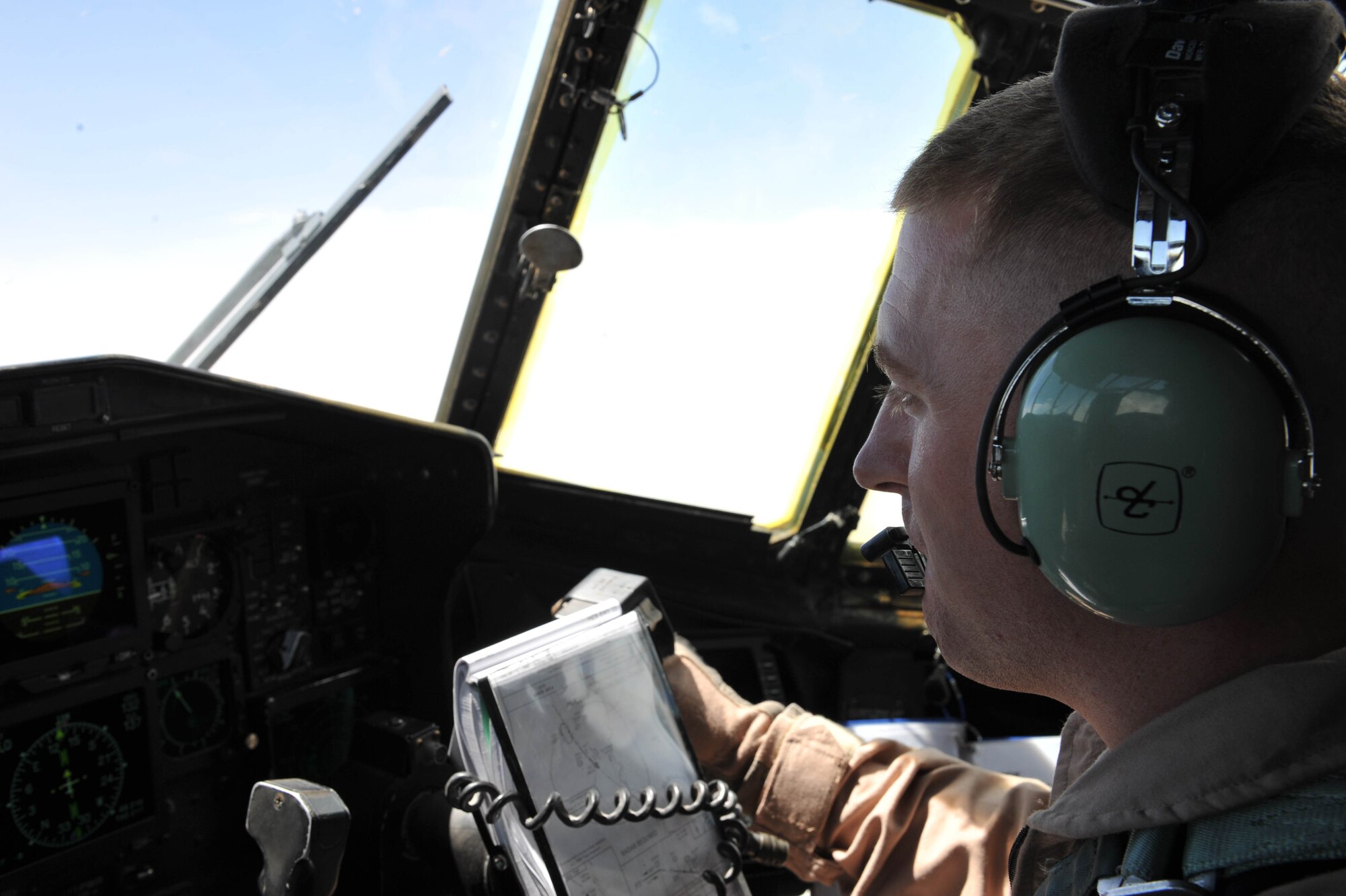 U.S. Air Force pilot, 1st Lt. Robert Ayers, flies a C-130 Hercules during an aeromedical evacuation mission in Iraq, May 13, 2010.  Lieutenant Ayers is deployed to the 777th Expeditionary Airlift Squadron, Joint Base Balad, Iraq.  (U.S. Air Force photo/Staff Sgt. Quinton Russ/released)