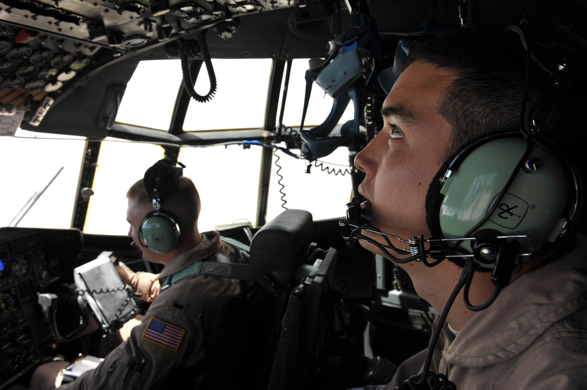 U.S. Air Force flight engineer, Staff Sgt. Sean Ryan, checks the  gauges of a C-130 Hercules during an aeromedical evacuation mission in Iraq, May 13, 2010.  Sergeant Ryan is deployed to the 777th Expeditionary Airlift Squadron, Joint Base Balad, Iraq.  (U.S. Air Force photo/Staff Sgt. Quinton Russ/released)