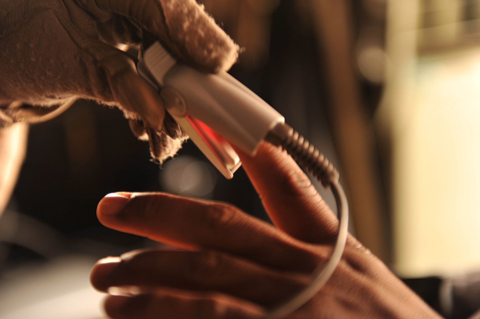 U.S. Air Force medical technician, Tech. Sgt. Sean Kassebaum, places a heart rate monitor on a patient during an aeromedical evacuation mission in Iraq, May 13, 2010.  Sergeant Kassebaum is deployed to the 332nd Expeditionary Aeromedical Evacuation Flight, Joint Base Balad, Iraq.  (U.S. Air Force photo/Staff Sgt. Quinton Russ/released)