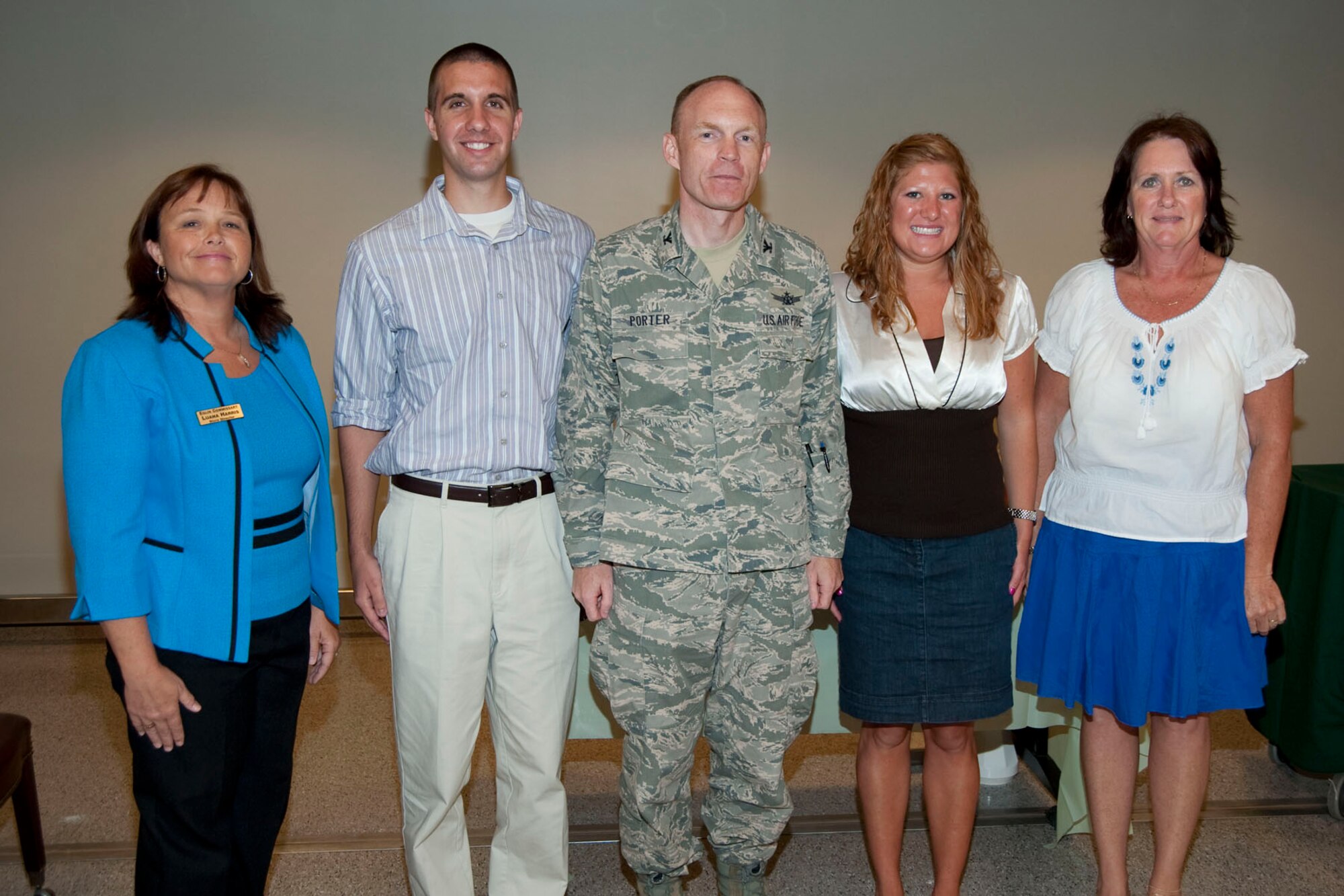 Commissary Director Luana Harris and 96 Air Base Wing Vice Commander, Col. William Porter, congratulate Thomas Reho and Whitney Schmeider on their scholarship award while Paula Ward-Farley, Sathers Candy Company looks on.  Also receiving scholarships are Lauren Halbert, Brianna Bikker and Patrick Fitzgerald. (USAF photo/Mike Fleck)

