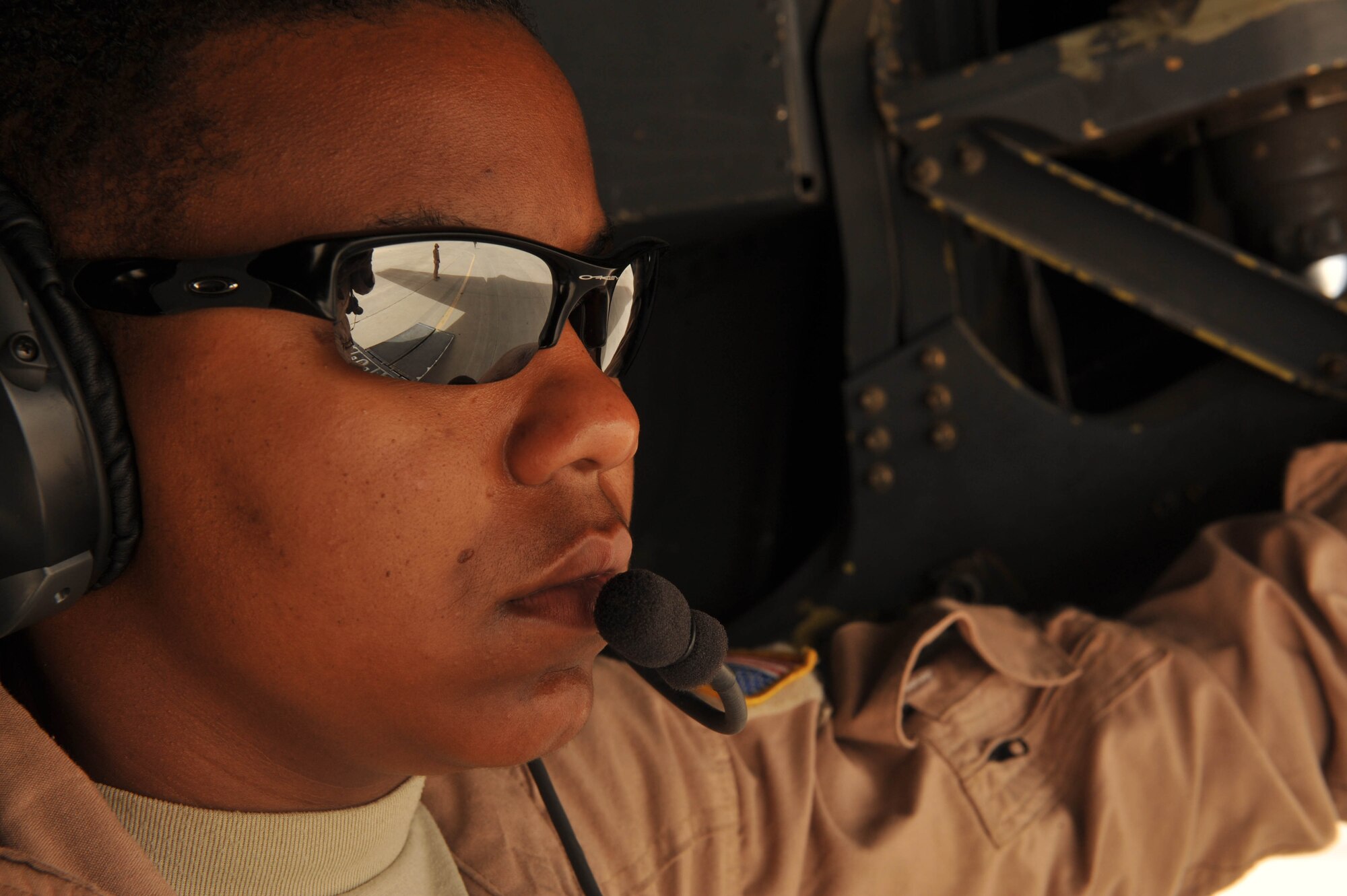 U.S. Air Force medical technician, Tech. Sgt. Melinda Ford, waits for patients to board a C-130 Hercules during an aeromedical evacuation mission at Mosul, Iraq, May 13, 2010.  Sergeant Ford is deployed to the 332nd Expeditionary Aeromedical Evacuation Flight, Joint Base Balad, Iraq.  (U.S. Air Force photo/Staff Sgt. Quinton Russ/released)